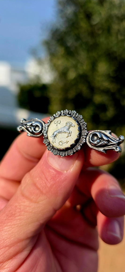 Such a fabulous piece of 1970s Zodiac jewellery! This hallmarked vintage brooch is beautifully crafted in solid sterling silver, with wonderfully ornate, almost medieval-inspired detailing.