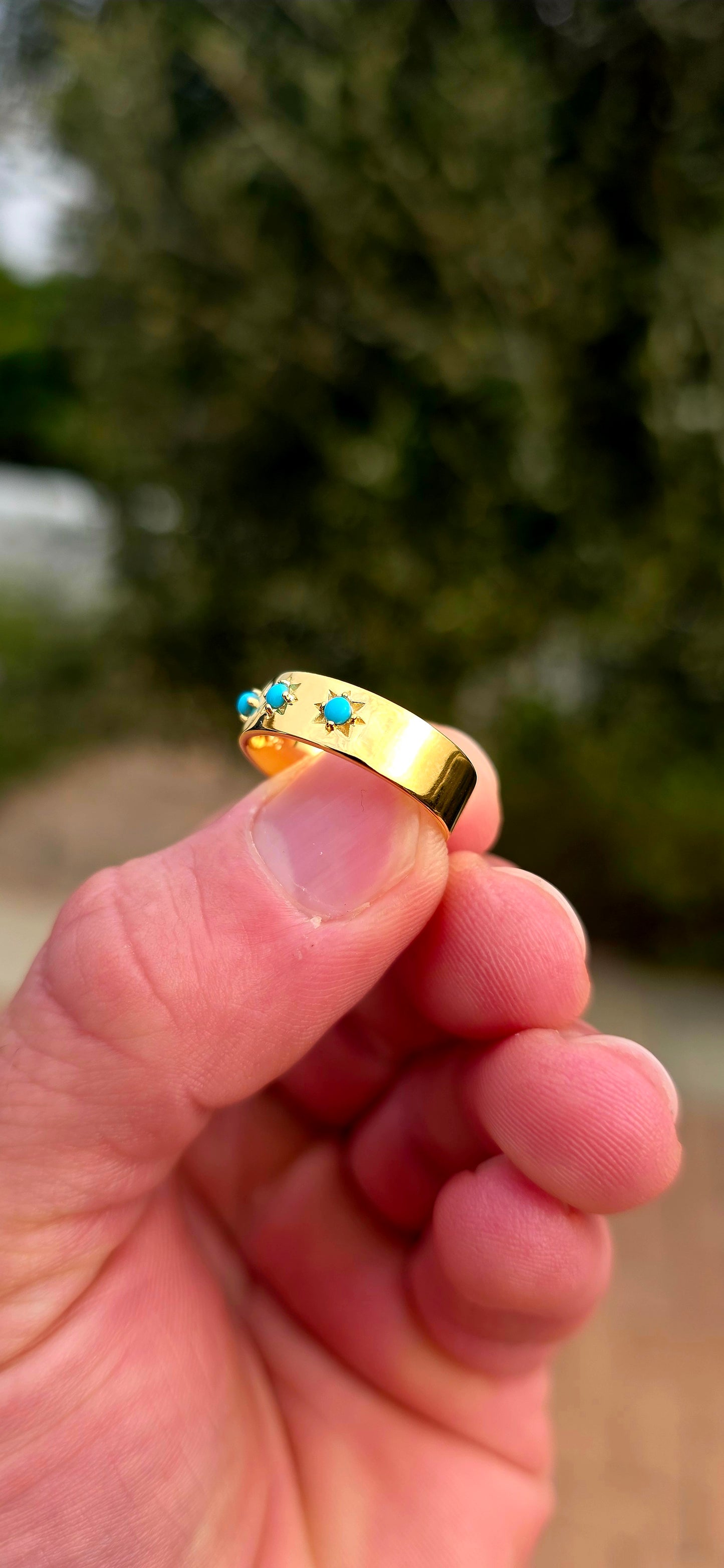 Quietly powerful, this unisex gypsy-style band has that wonderful old-world character with a bold pop of turquoise blue.