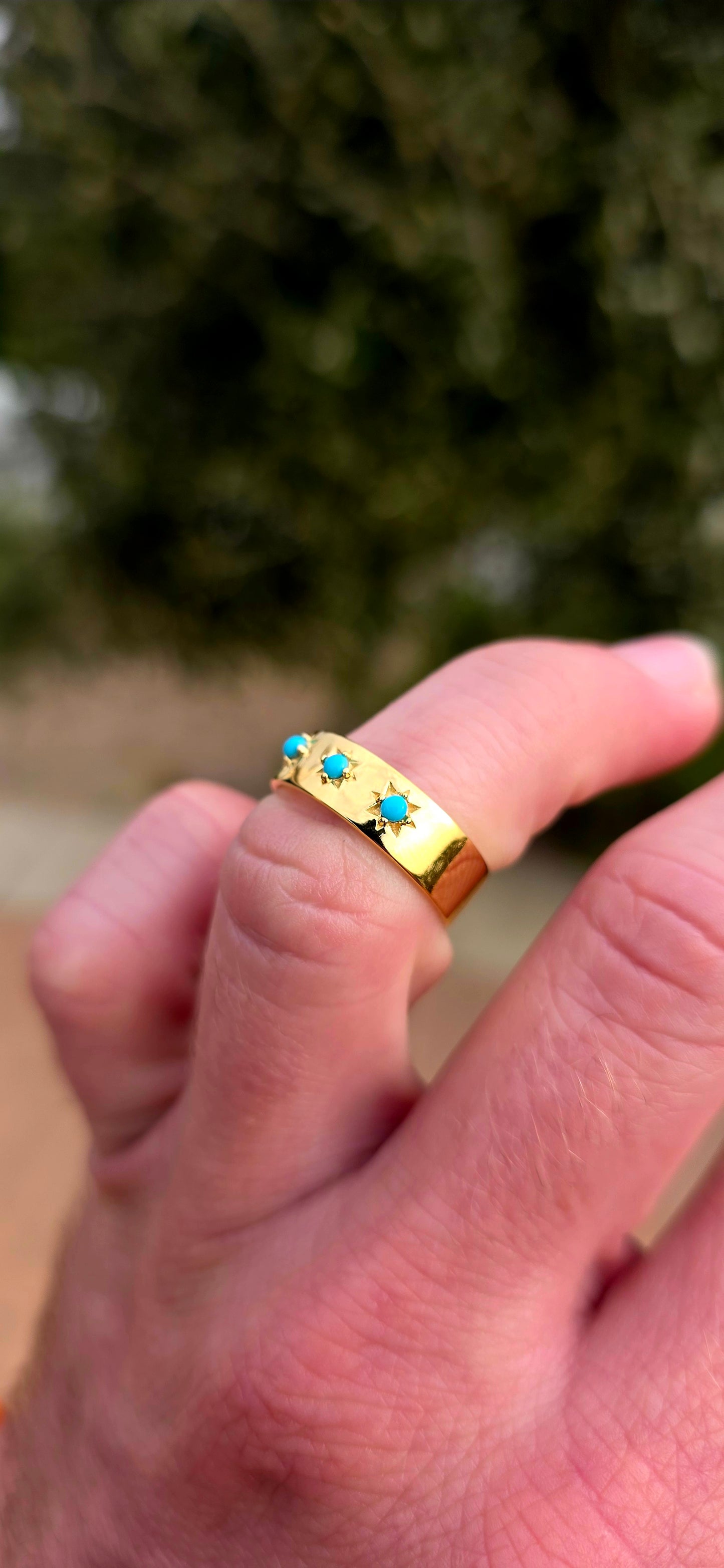 Quietly powerful, this unisex gypsy-style band has that wonderful old-world character with a bold pop of turquoise blue.