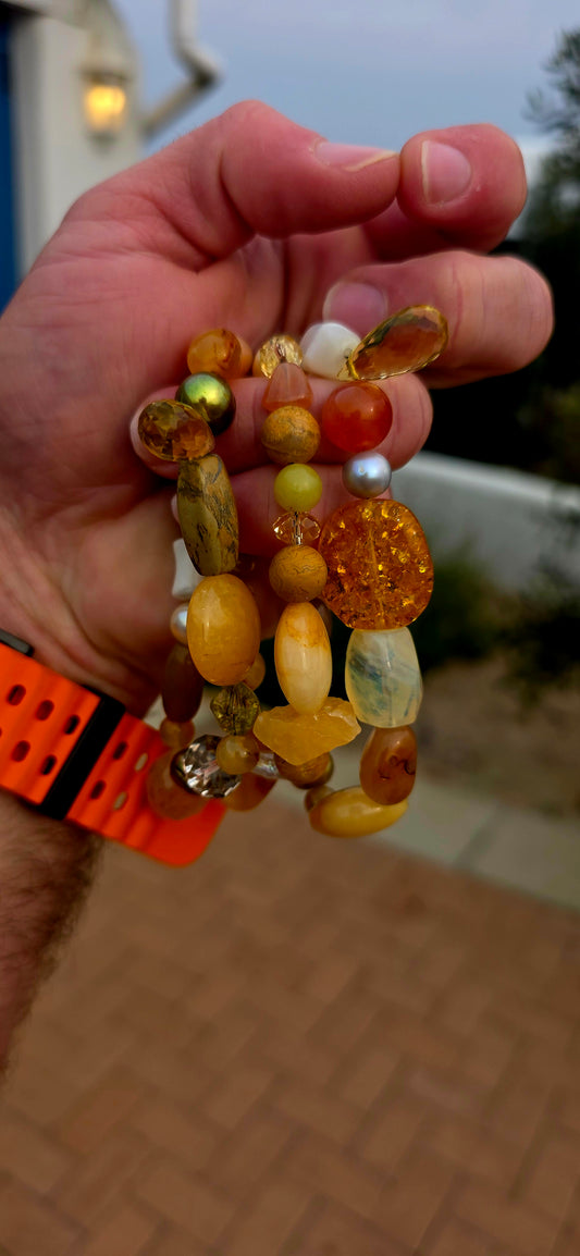 All the glorious colours of autumn wrapped around your wrist!  A fabulous collection of three chunky gemstone stretch bracelets, individually strung with an eclectic mix of natural gemstones in warm honey, caramel, cognac, golden yellow and earthy brown.