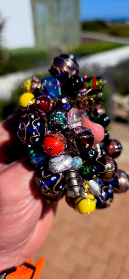 Now THIS is a bracelet that knows how to make an entrance!  An absolutely fabulous vintage cha-cha bracelet, gloriously chunky, colourful and packed with one of the most beautiful collections of Venetian/Murano-style art glass beads I’ve seen in a while.