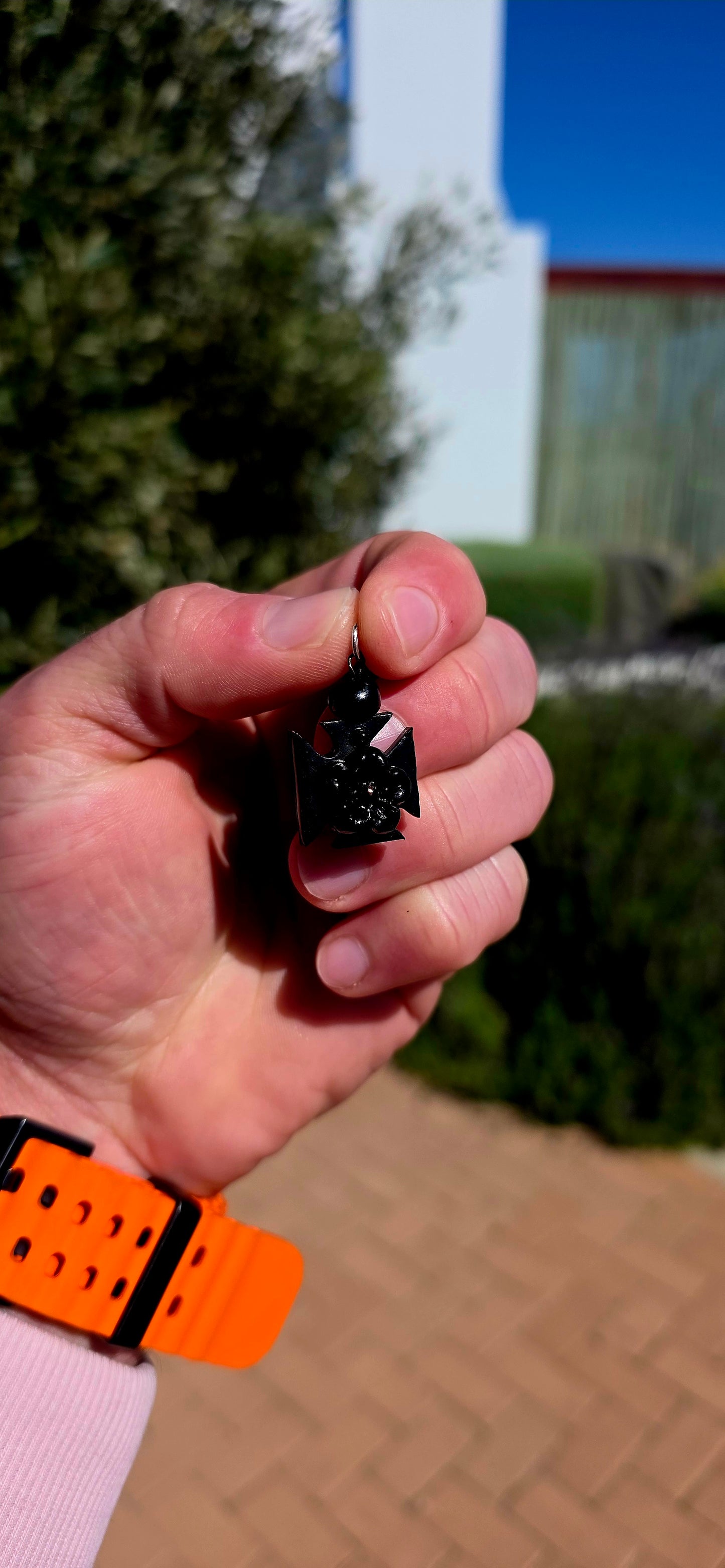 A wonderfully unusual little survivor from the Victorian era — an antique hand-carved Whitby jet pendant/charm, beautifully fashioned into the distinctive form of a Maltese cross.