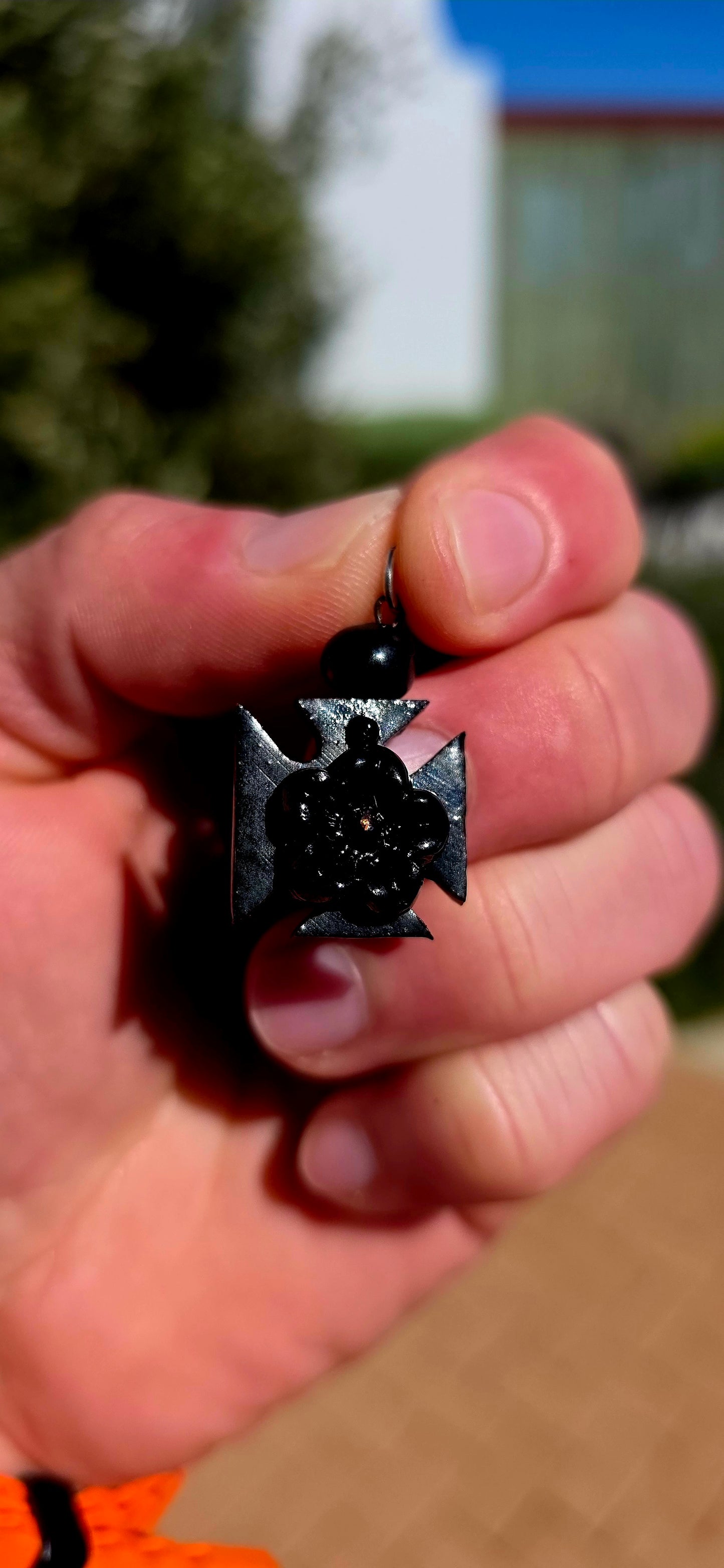 A wonderfully unusual little survivor from the Victorian era — an antique hand-carved Whitby jet pendant/charm, beautifully fashioned into the distinctive form of a Maltese cross.