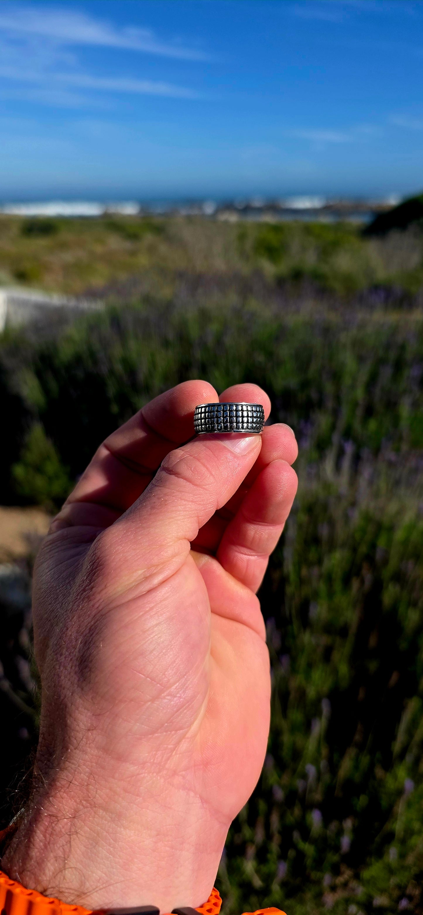 Modern, graphic and UNISEX! This solid sterling silver band features a fabulous all-over engraved brickwork/grid design, giving the ring a wonderfully architectural, almost industrial feel.