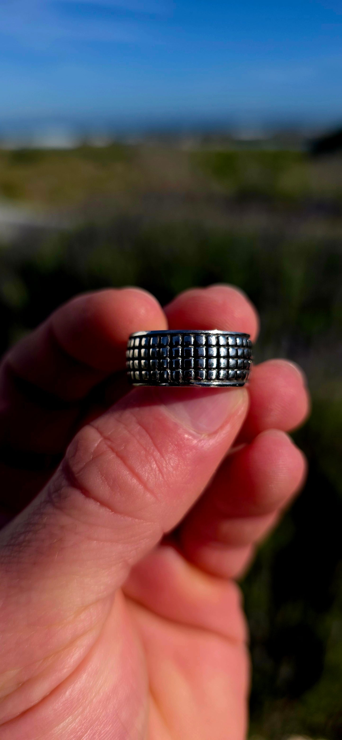 Modern, graphic and UNISEX! This solid sterling silver band features a fabulous all-over engraved brickwork/grid design, giving the ring a wonderfully architectural, almost industrial feel.