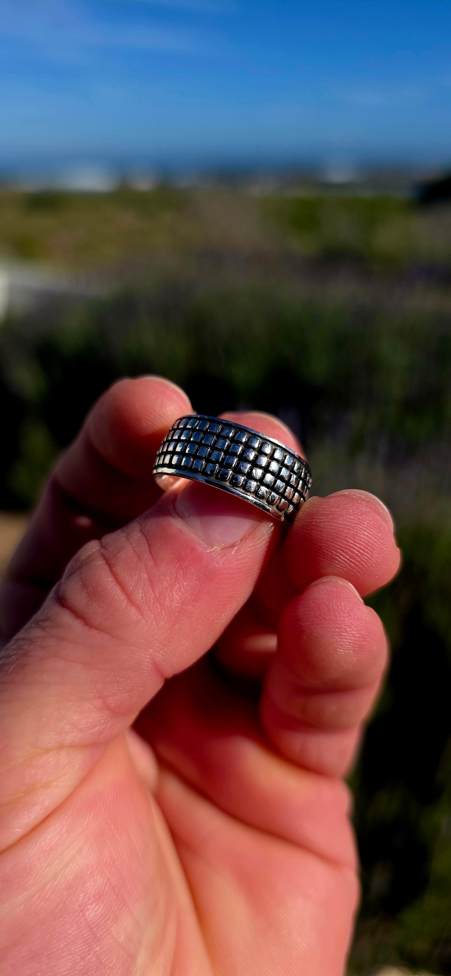 Modern, graphic and UNISEX! This solid sterling silver band features a fabulous all-over engraved brickwork/grid design, giving the ring a wonderfully architectural, almost industrial feel.