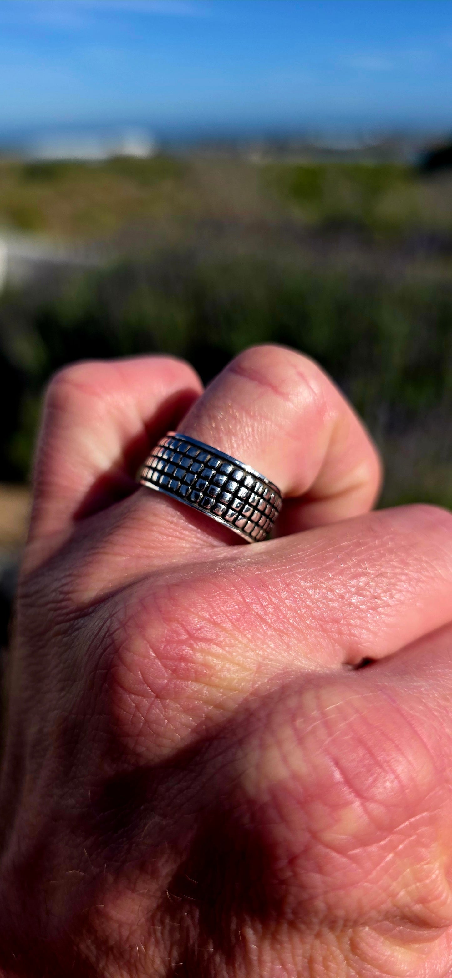 Modern, graphic and UNISEX! This solid sterling silver band features a fabulous all-over engraved brickwork/grid design, giving the ring a wonderfully architectural, almost industrial feel.