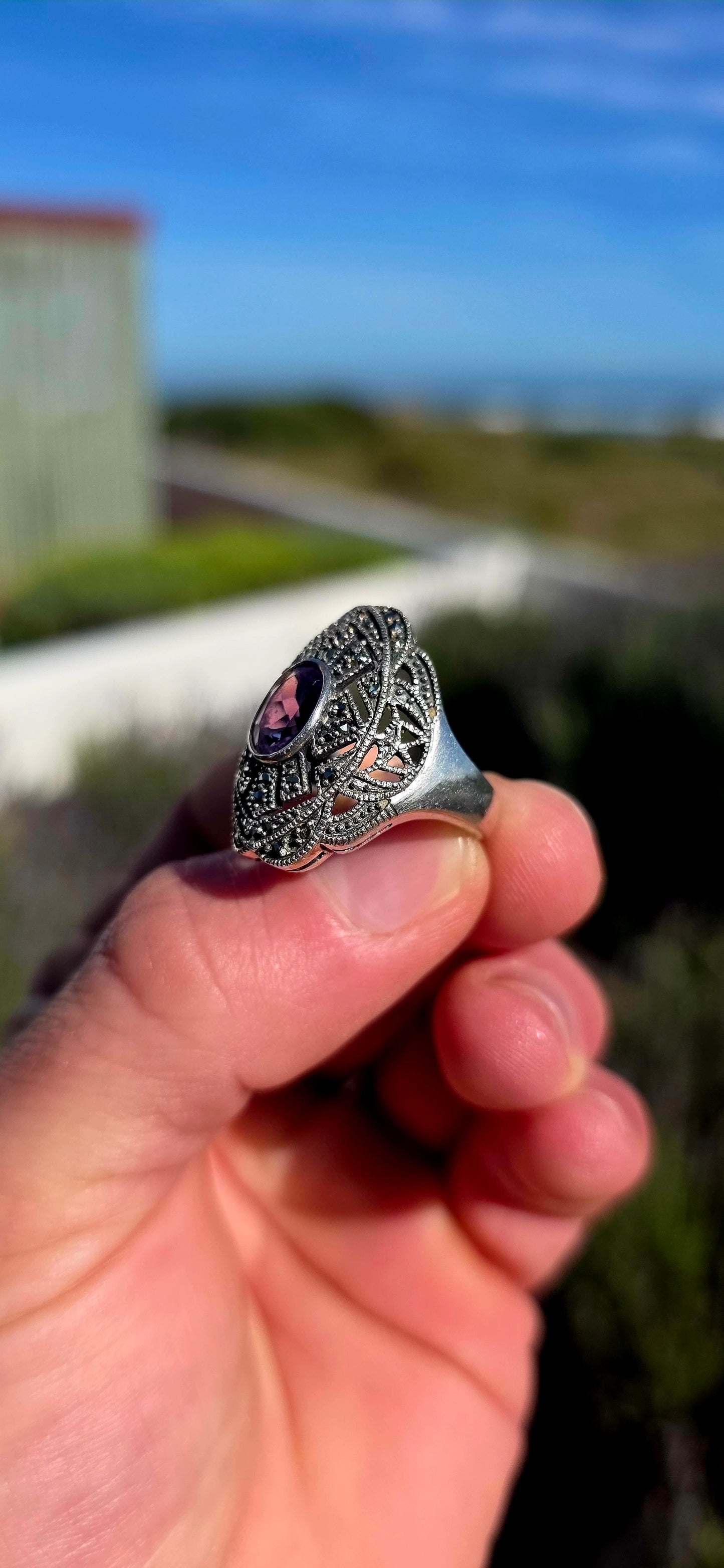 Bold, architectural and fabulously glamorous! This chunky Art Deco Revival dress ring is crafted in solid sterling silver and features an elongated statement face with intricate pierced filigree-style openwork.