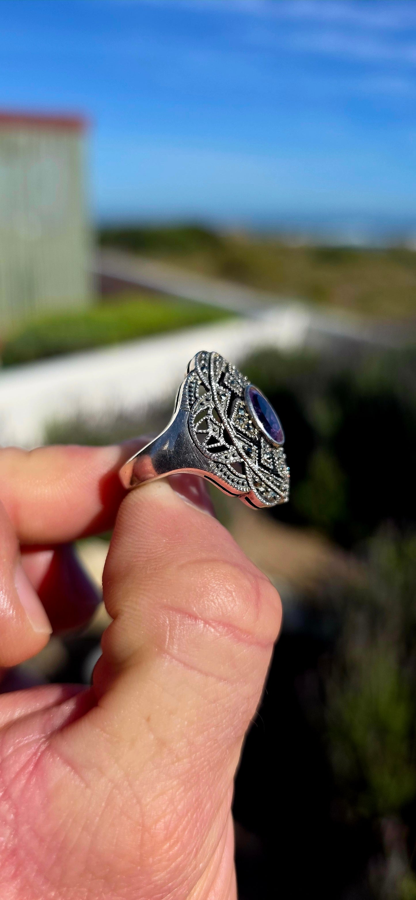 Bold, architectural and fabulously glamorous! This chunky Art Deco Revival dress ring is crafted in solid sterling silver and features an elongated statement face with intricate pierced filigree-style openwork.