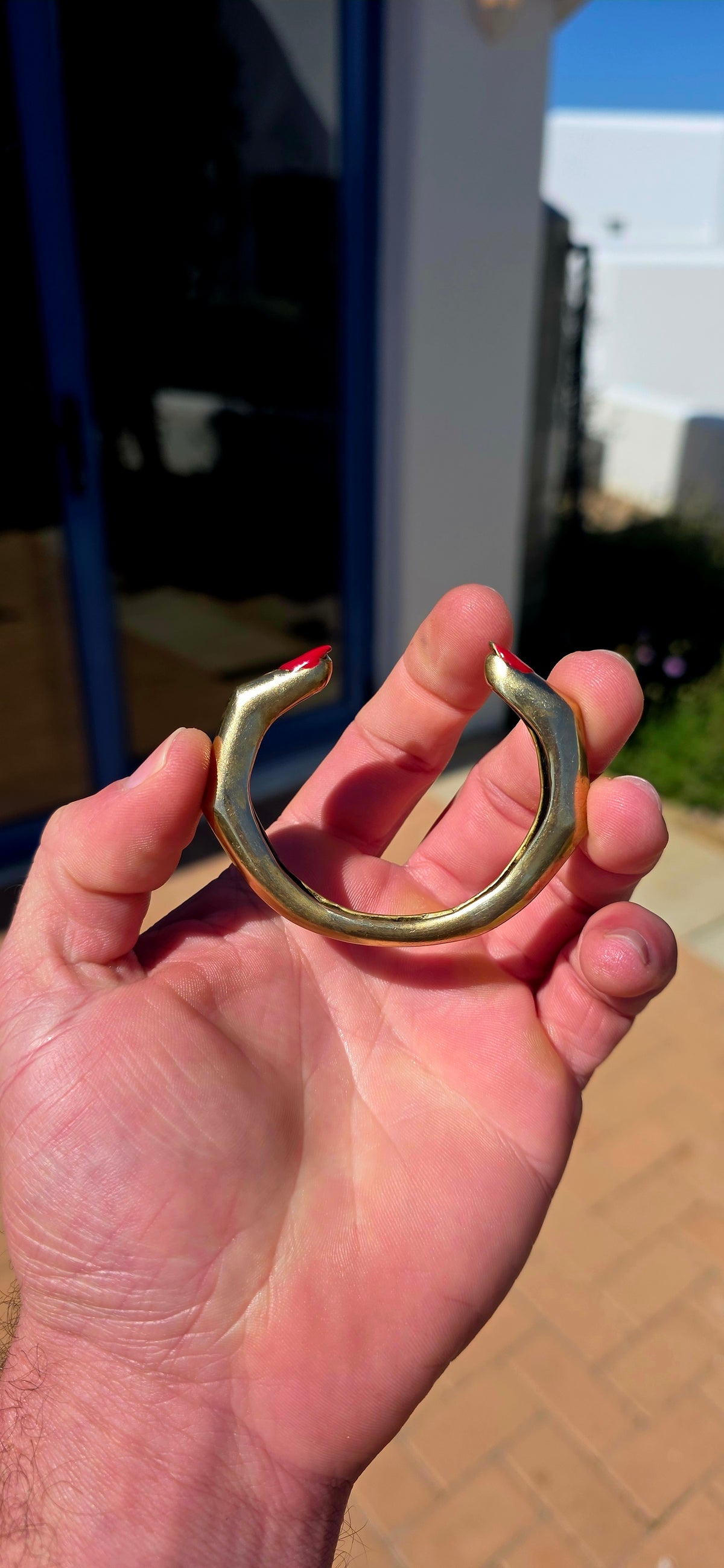 From cult Italian jewellery designer Delfina Delettrez, this fabulous and VERY sought-after “Finger Mood” cuff bracelet is sculpted in bronze as two beautifully surreal fingers wrapping around the wrist — complete with those wonderfully cheeky red enamel.