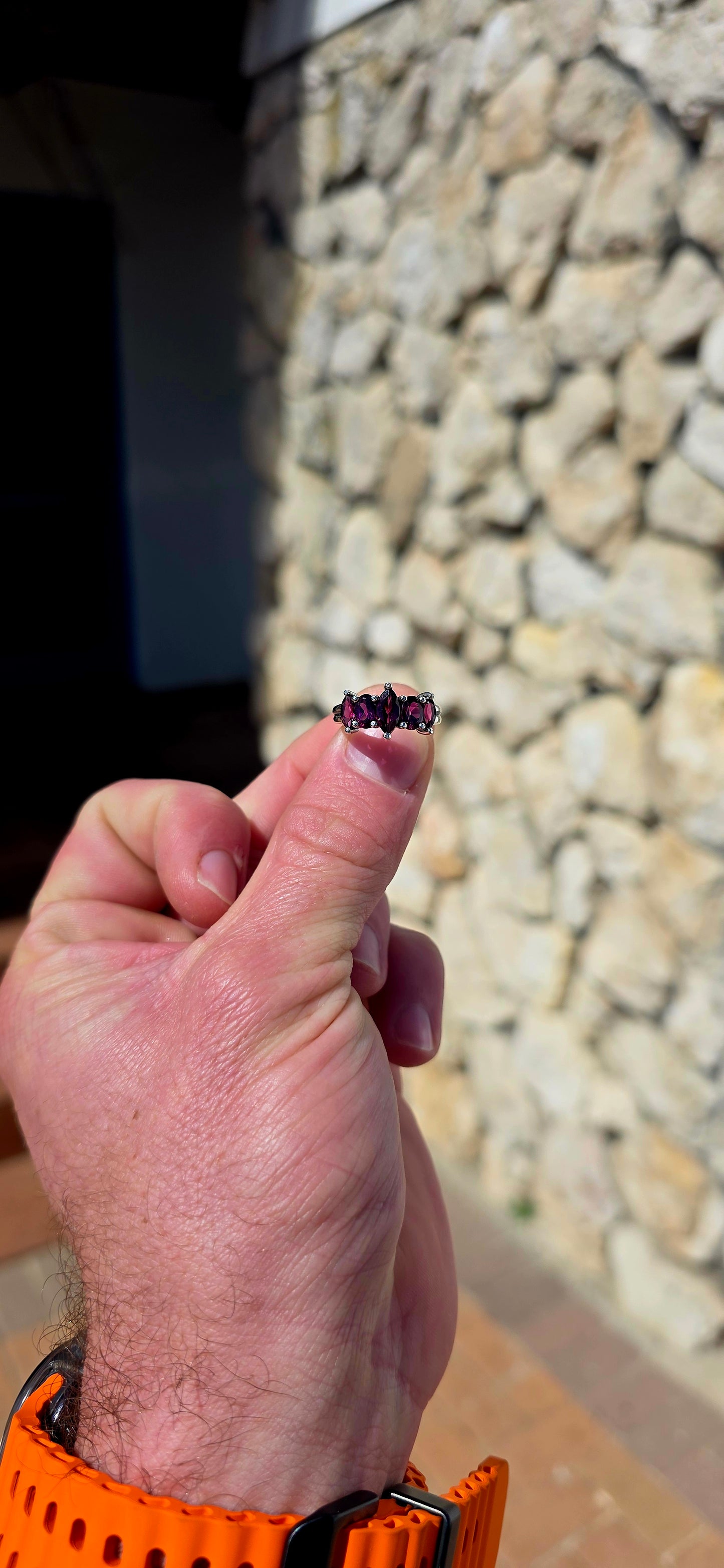 Rich, elegant and beautiful!! This sterling silver half-eternity style ring showcases a gorgeous graduated arrangement of five natural rhodolite garnets, each individually prong-set to maximise their colour and sparkle.