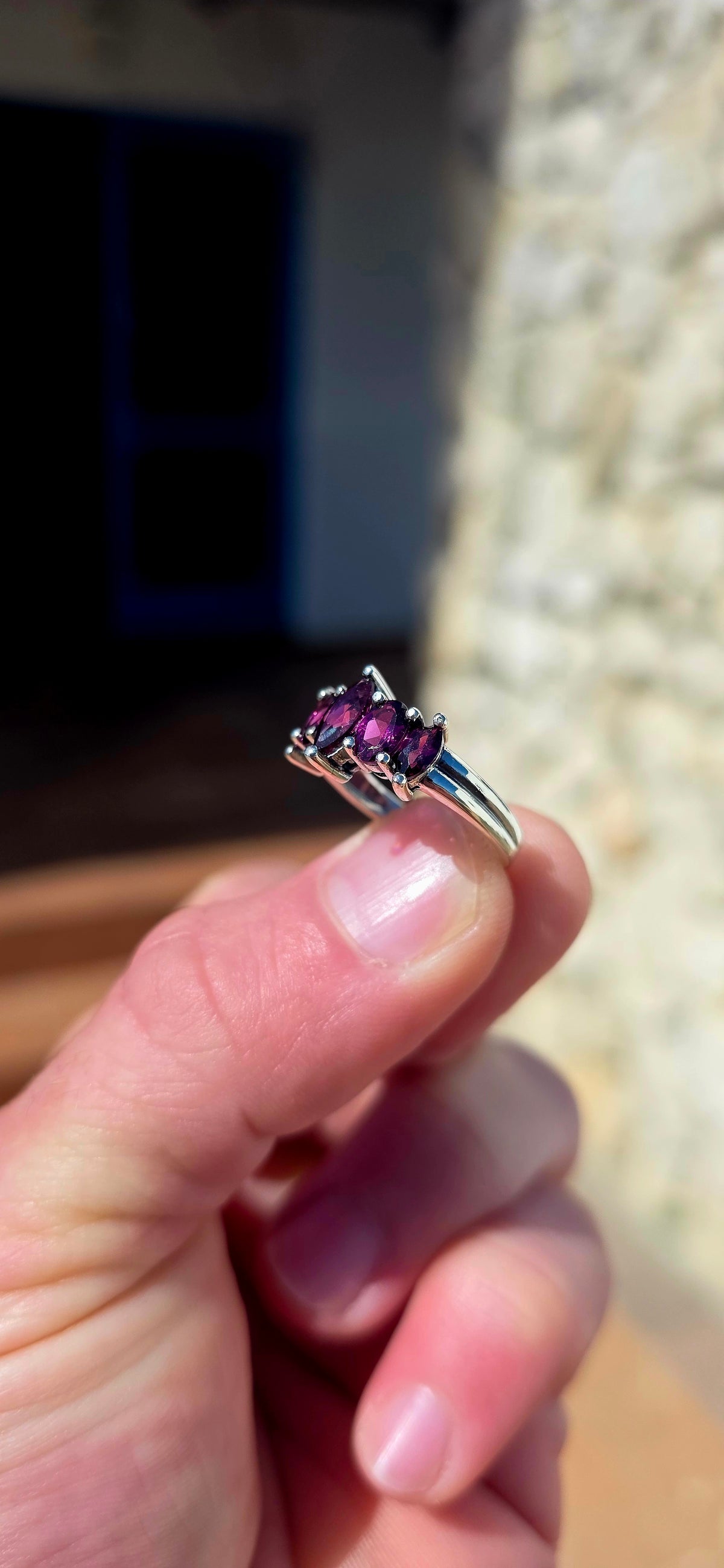 Rich, elegant and beautiful!! This sterling silver half-eternity style ring showcases a gorgeous graduated arrangement of five natural rhodolite garnets, each individually prong-set to maximise their colour and sparkle.