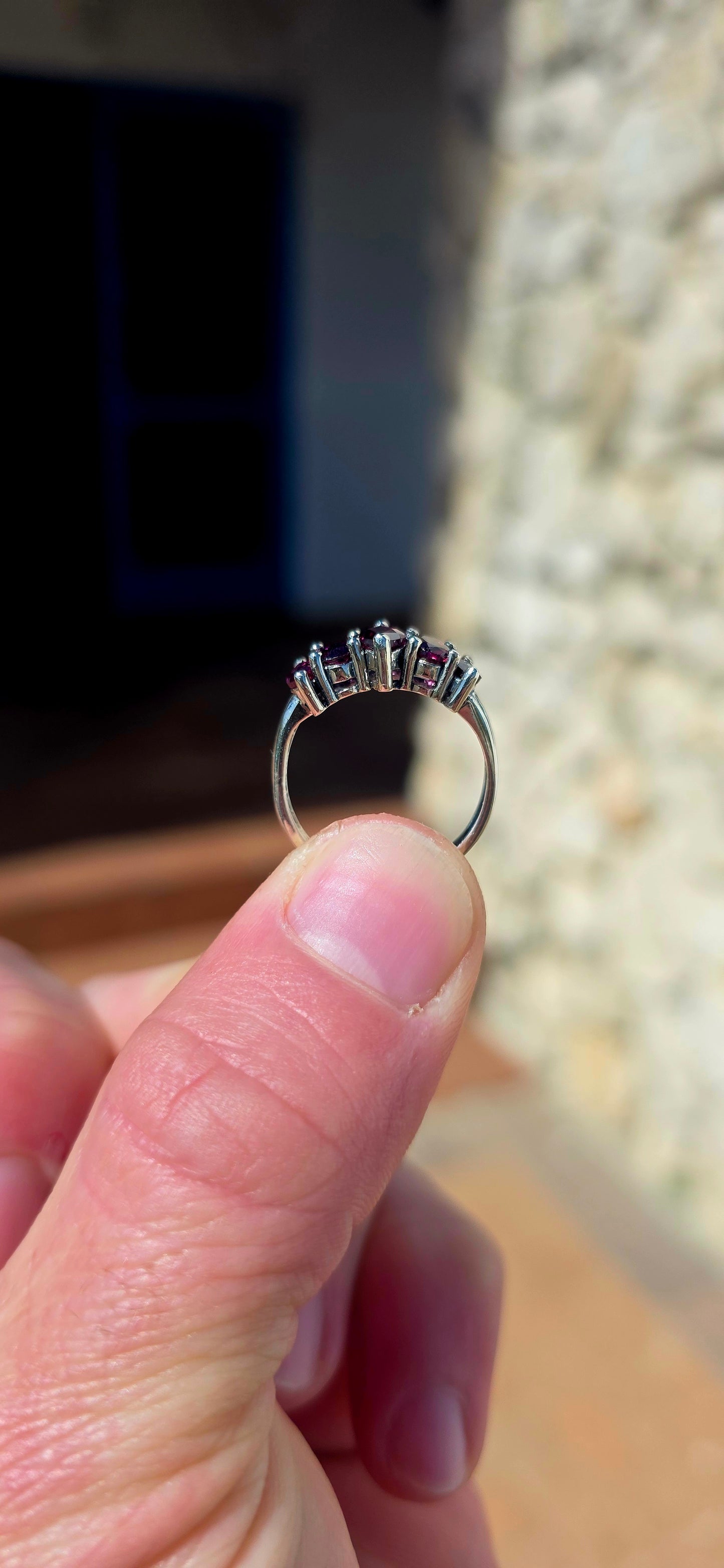Rich, elegant and beautiful!! This sterling silver half-eternity style ring showcases a gorgeous graduated arrangement of five natural rhodolite garnets, each individually prong-set to maximise their colour and sparkle.