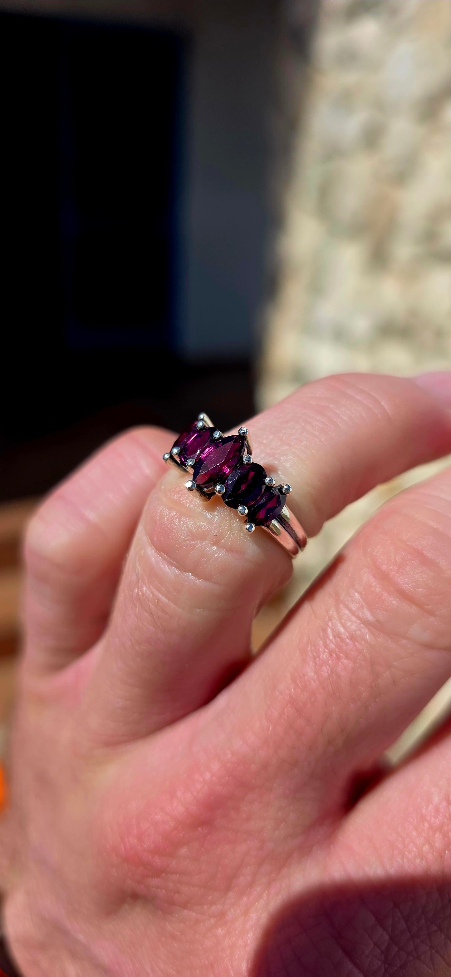 Rich, elegant and beautiful!! This sterling silver half-eternity style ring showcases a gorgeous graduated arrangement of five natural rhodolite garnets, each individually prong-set to maximise their colour and sparkle.