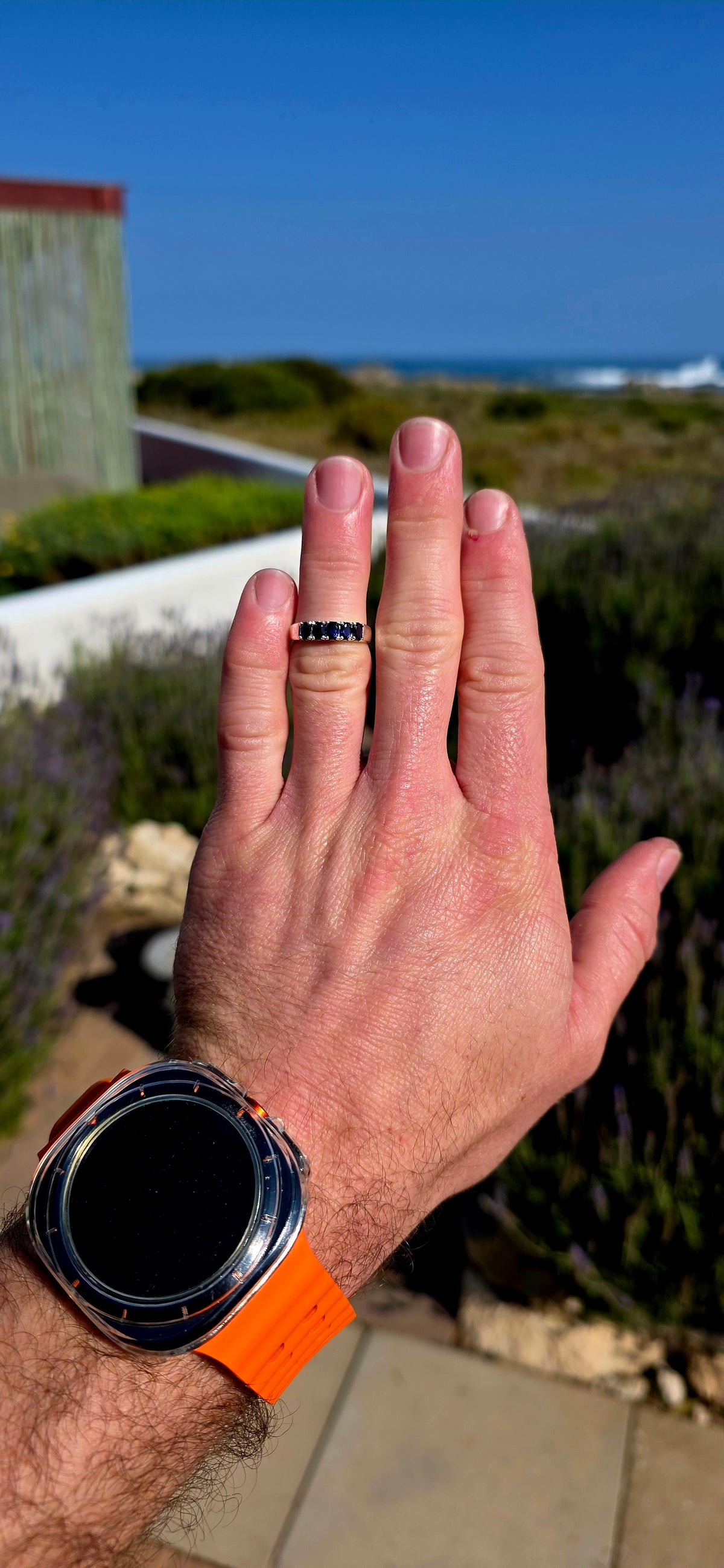 Understated, elegant and wonderfully easy to wear! This sterling silver half-eternity stacking ring is beautifully prong-set across the front with five oval-cut natural iolite gemstones.