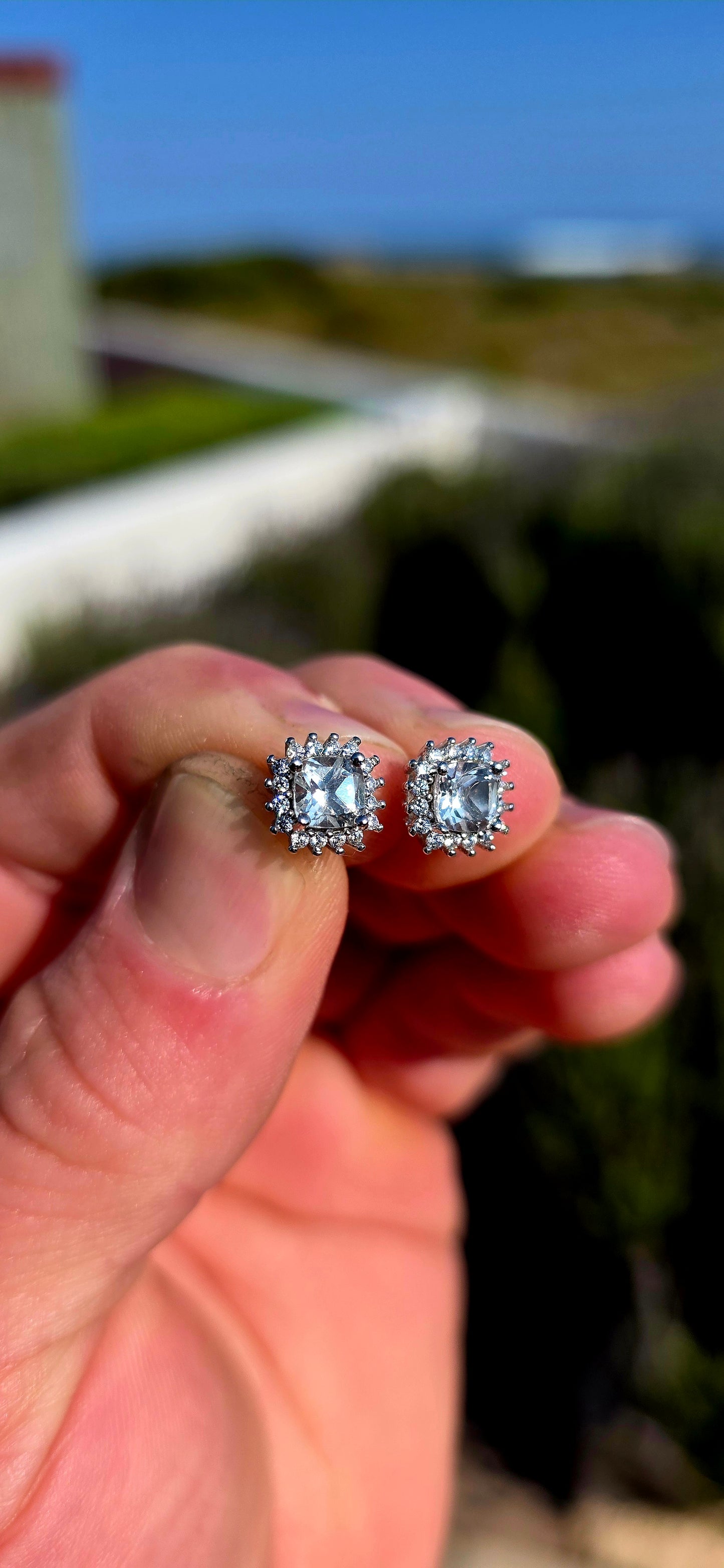 Classic sparkle with a fabulous vintage-inspired feel! These sterling silver halo stud earrings feature a beautifully faceted cushion-cut clear quartz at the centre of each earring, securely prong-set.