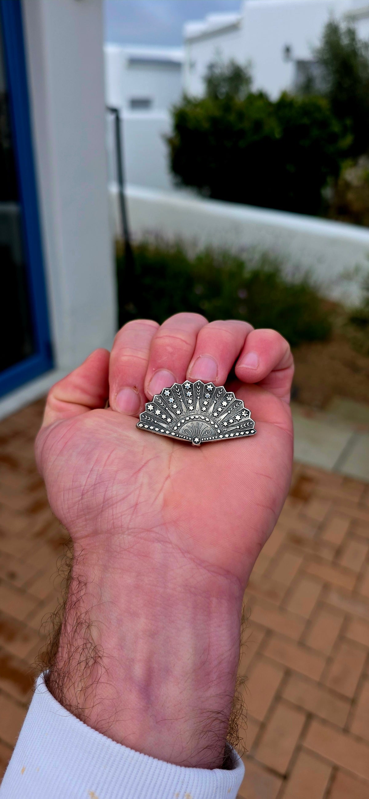 Ohhh this is a BEAUTIFUL little piece of Victorian silver! An antique circa 1876 sterling silver brooch, wonderfully fashioned as an open folding fan and covered from edge to edge in intricate embossed and engraved decoration.