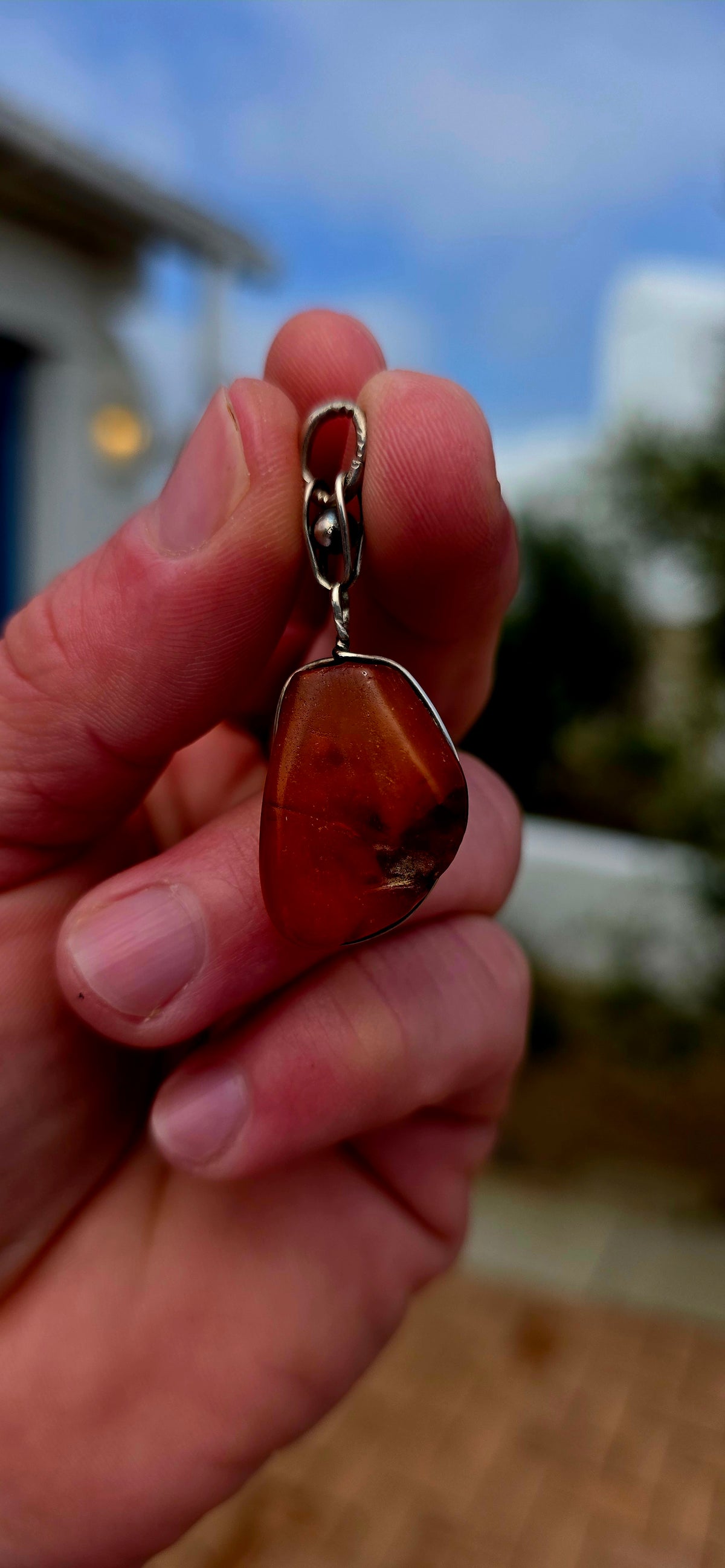 Ancient looking and absolutely gorgeous! This antique sterling silver pendant celebrates amber in its most beautifully organic form — irregular, earthy and completely individual.