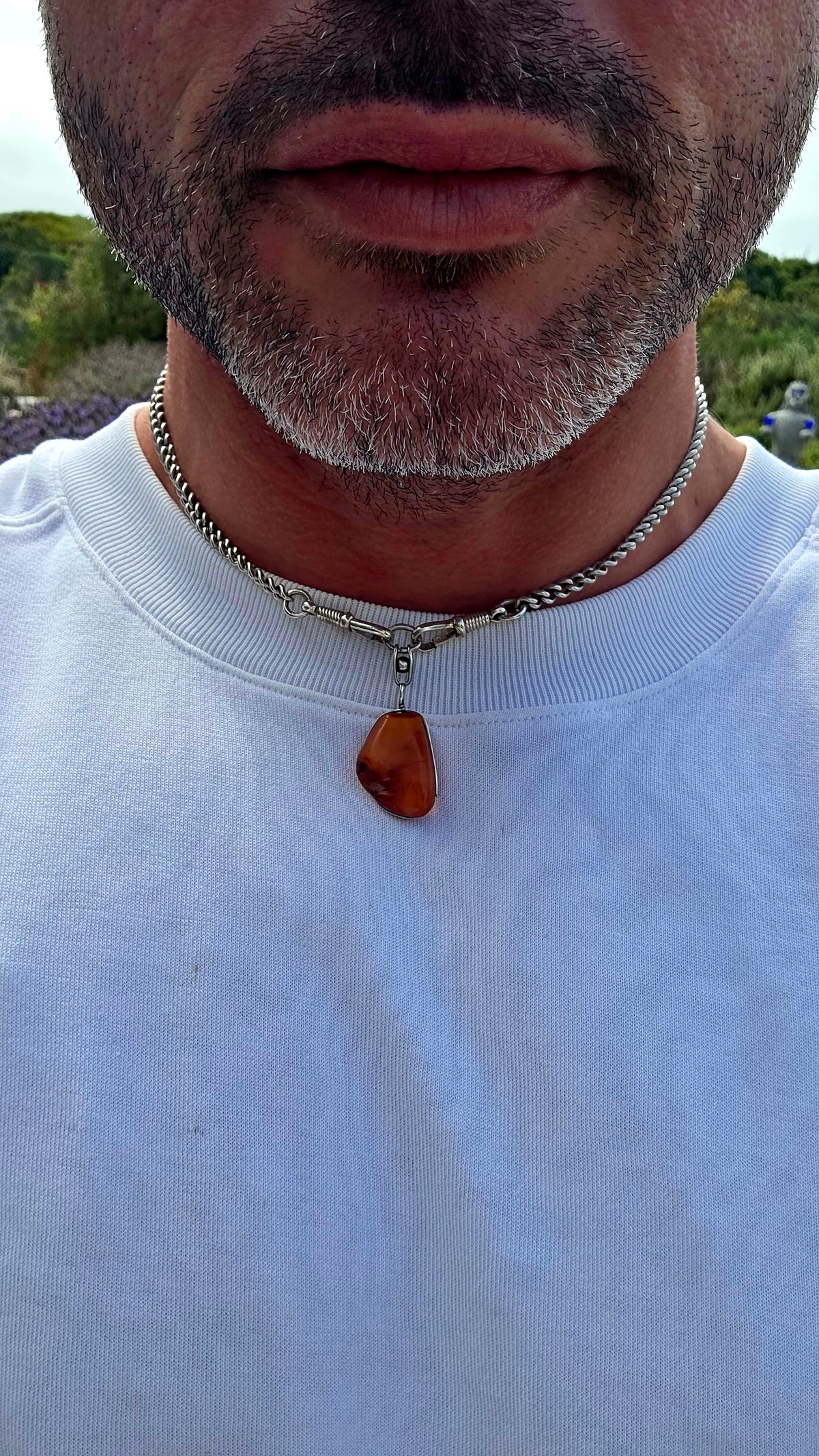 Ancient looking and absolutely gorgeous! This antique sterling silver pendant celebrates amber in its most beautifully organic form — irregular, earthy and completely individual.