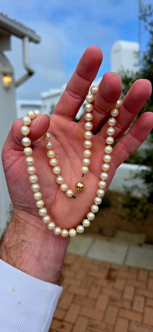 Beautifully timeless! Dating to the Art Deco era, this elegant necklace features a long single strand of wonderfully lustrous marine cultured pearls, displaying creamy ivory tones with that gorgeous soft glow only pearls can give.