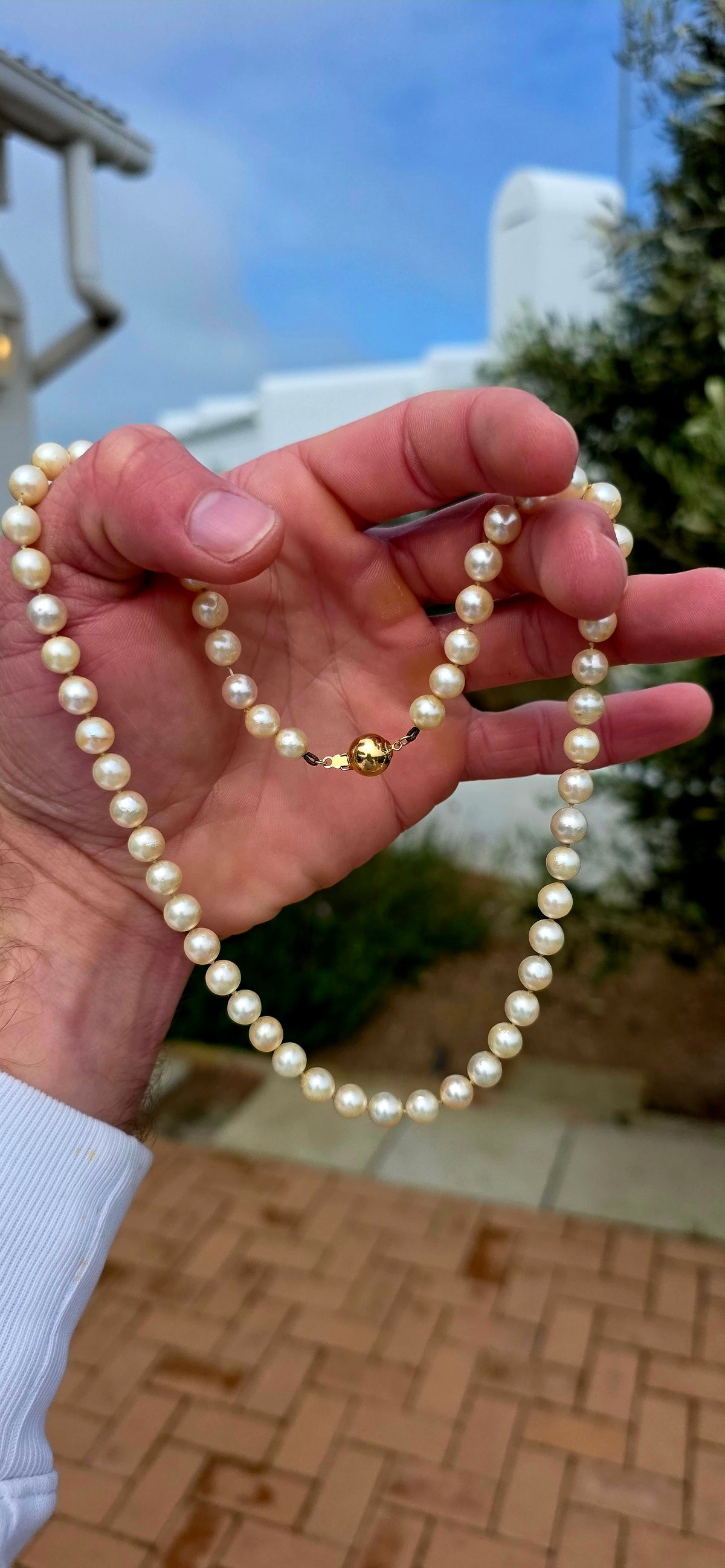Beautifully timeless! Dating to the Art Deco era, this elegant necklace features a long single strand of wonderfully lustrous marine cultured pearls, displaying creamy ivory tones with that gorgeous soft glow only pearls can give.