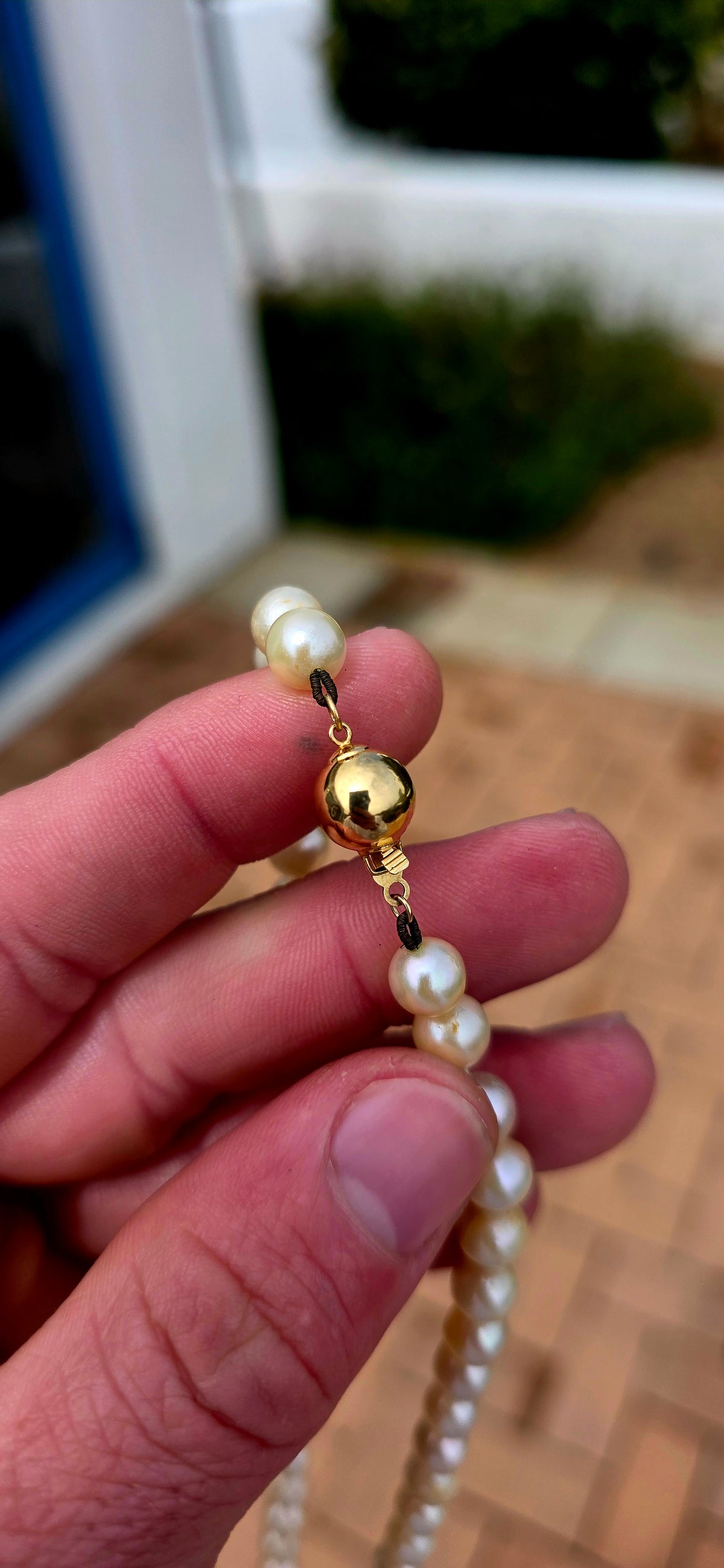 Beautifully timeless! Dating to the Art Deco era, this elegant necklace features a long single strand of wonderfully lustrous marine cultured pearls, displaying creamy ivory tones with that gorgeous soft glow only pearls can give.