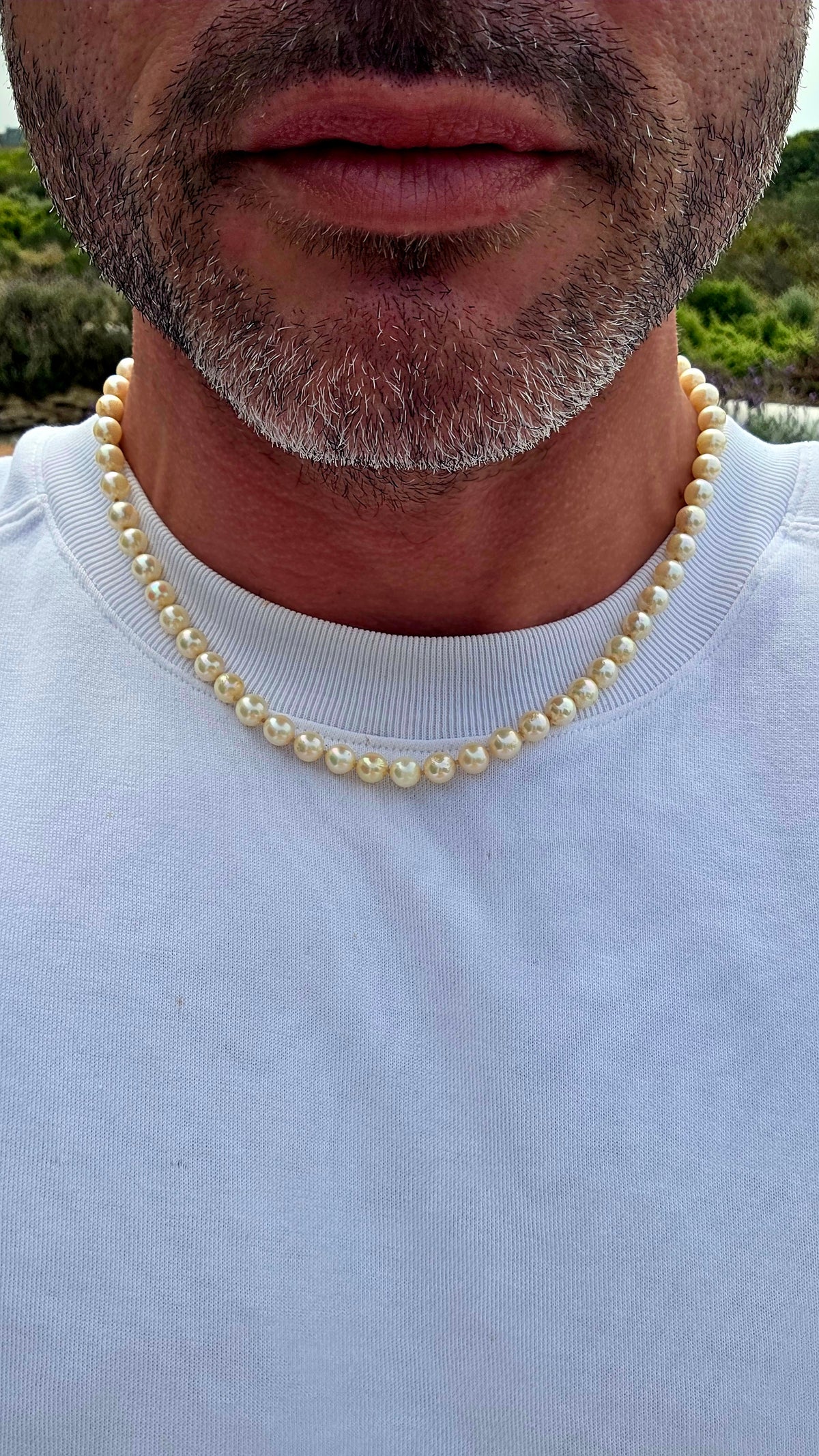 Beautifully timeless! Dating to the Art Deco era, this elegant necklace features a long single strand of wonderfully lustrous marine cultured pearls, displaying creamy ivory tones with that gorgeous soft glow only pearls can give.