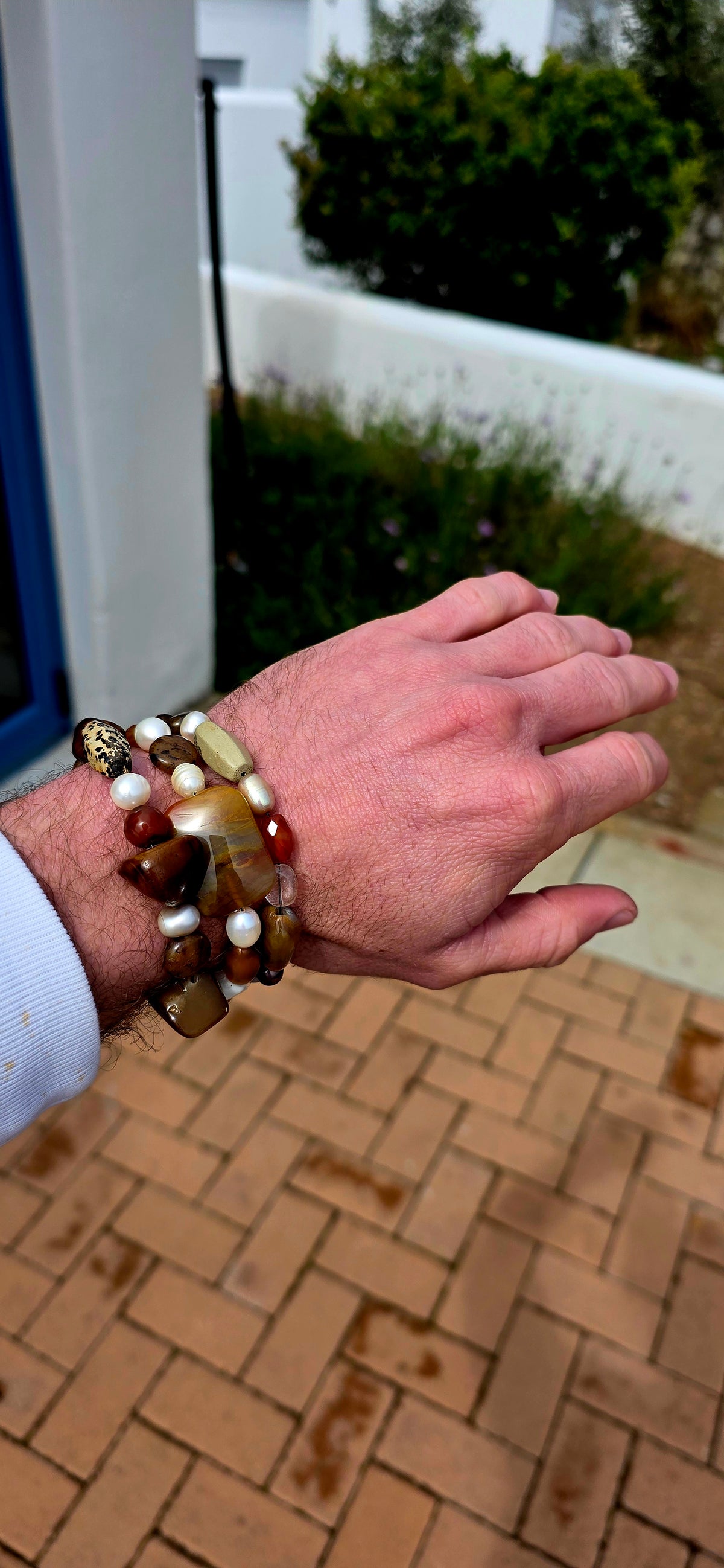 What an absolutely GORGEOUS earthy trio! The trio consists of three individual stretch bracelets, each strung with an eclectic mixture of natural gemstones and freshwater pearls in beautifully warm, organic tones.