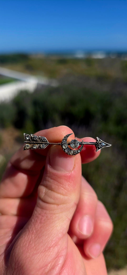 Ohhh this is a FABULOUS piece of Victorian celestial jewellery! Dating to the late 19th century, this antique brooch is crafted in sterling silver and designed as an elegant arrow piercing straight through a crescent moon.