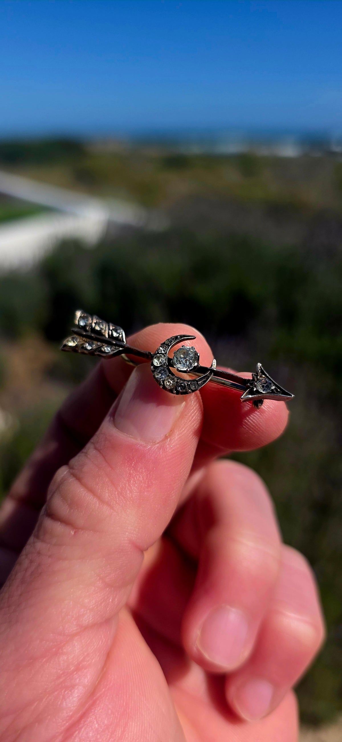 Ohhh this is a FABULOUS piece of Victorian celestial jewellery! Dating to the late 19th century, this antique brooch is crafted in sterling silver and designed as an elegant arrow piercing straight through a crescent moon.