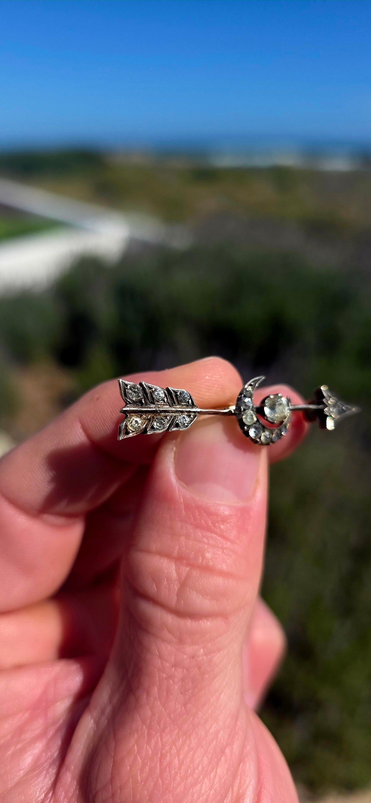Ohhh this is a FABULOUS piece of Victorian celestial jewellery! Dating to the late 19th century, this antique brooch is crafted in sterling silver and designed as an elegant arrow piercing straight through a crescent moon.