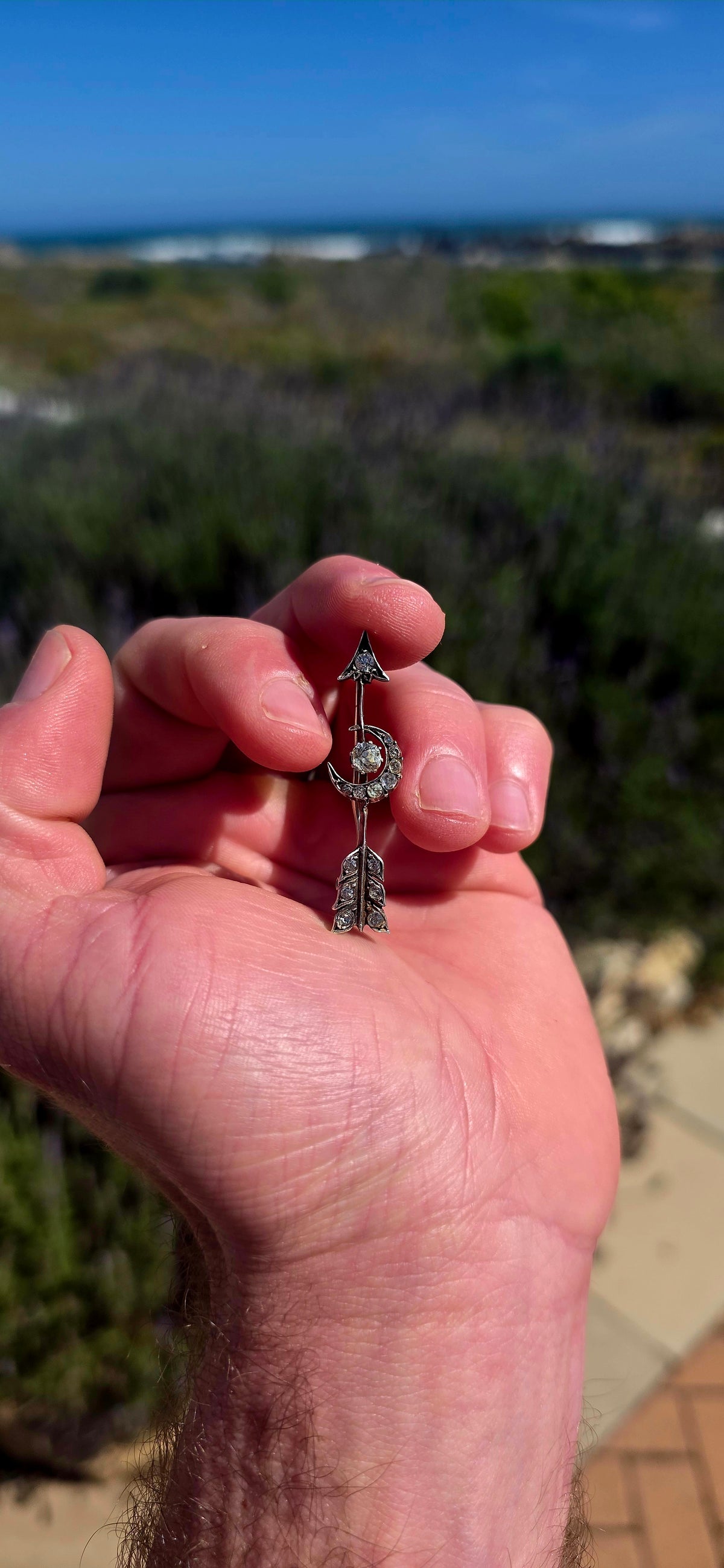 Ohhh this is a FABULOUS piece of Victorian celestial jewellery! Dating to the late 19th century, this antique brooch is crafted in sterling silver and designed as an elegant arrow piercing straight through a crescent moon.