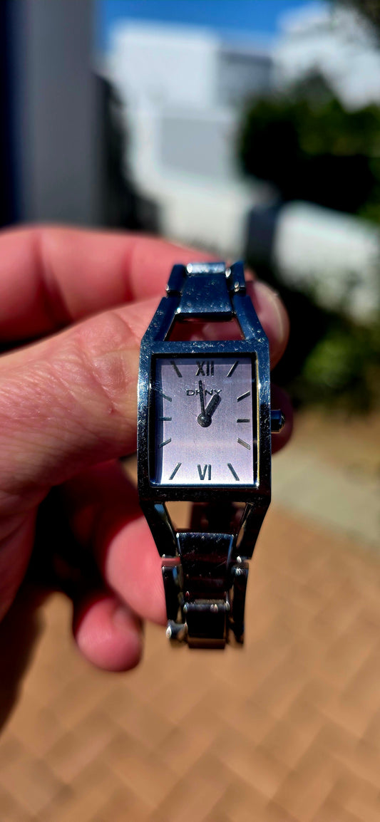 Sleek, sophisticated and wonderfully wearable — a classic ladies’ designer quartz watch by DKNY (Donna Karan New York), with that clean metropolitan styling the brand is so well known for.