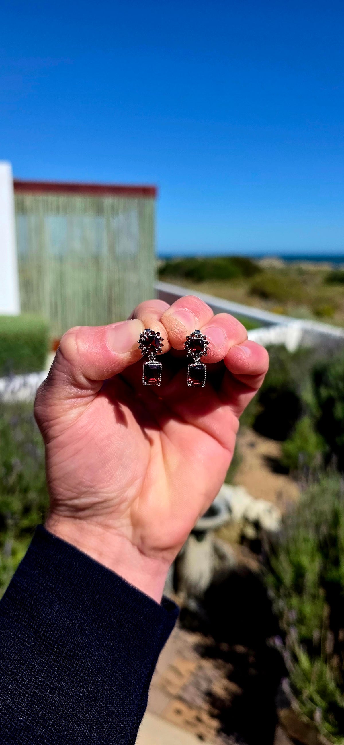 Oh these are GORGEOUS! Rich, dramatic and beautifully feminine — a fabulous pair of solid sterling silver drop earrings absolutely dripping in deep wine-red garnets.