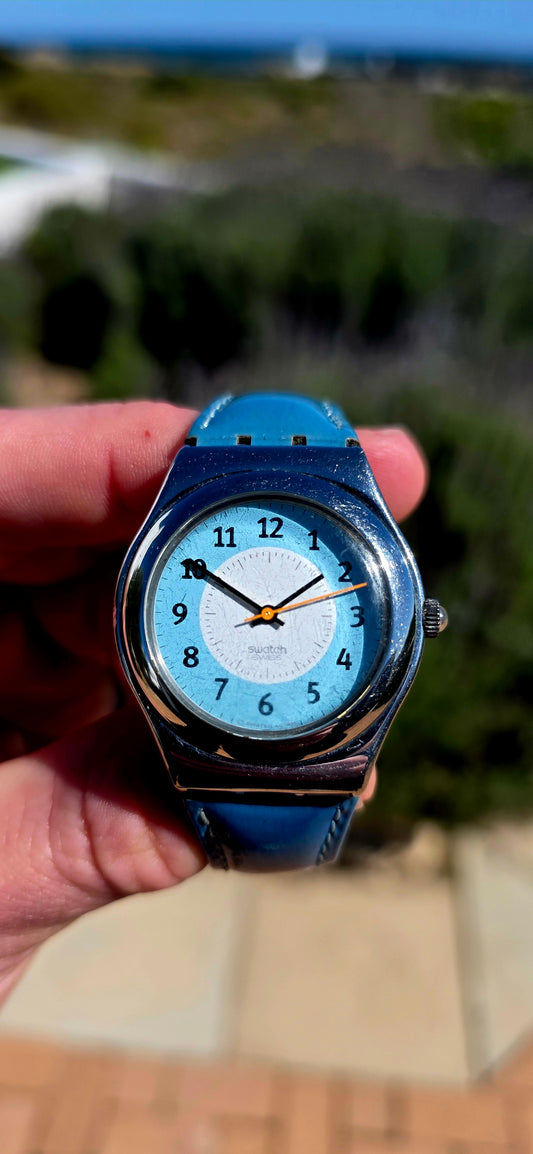 A fabulous piece of 1990s Swiss design! This vintage 1996 unisex Swatch Irony Medium “Mentafredda” wristwatch has that unmistakably playful Swatch aesthetic, but with the more substantial feel of the brand’s stainless-steel Irony collection.