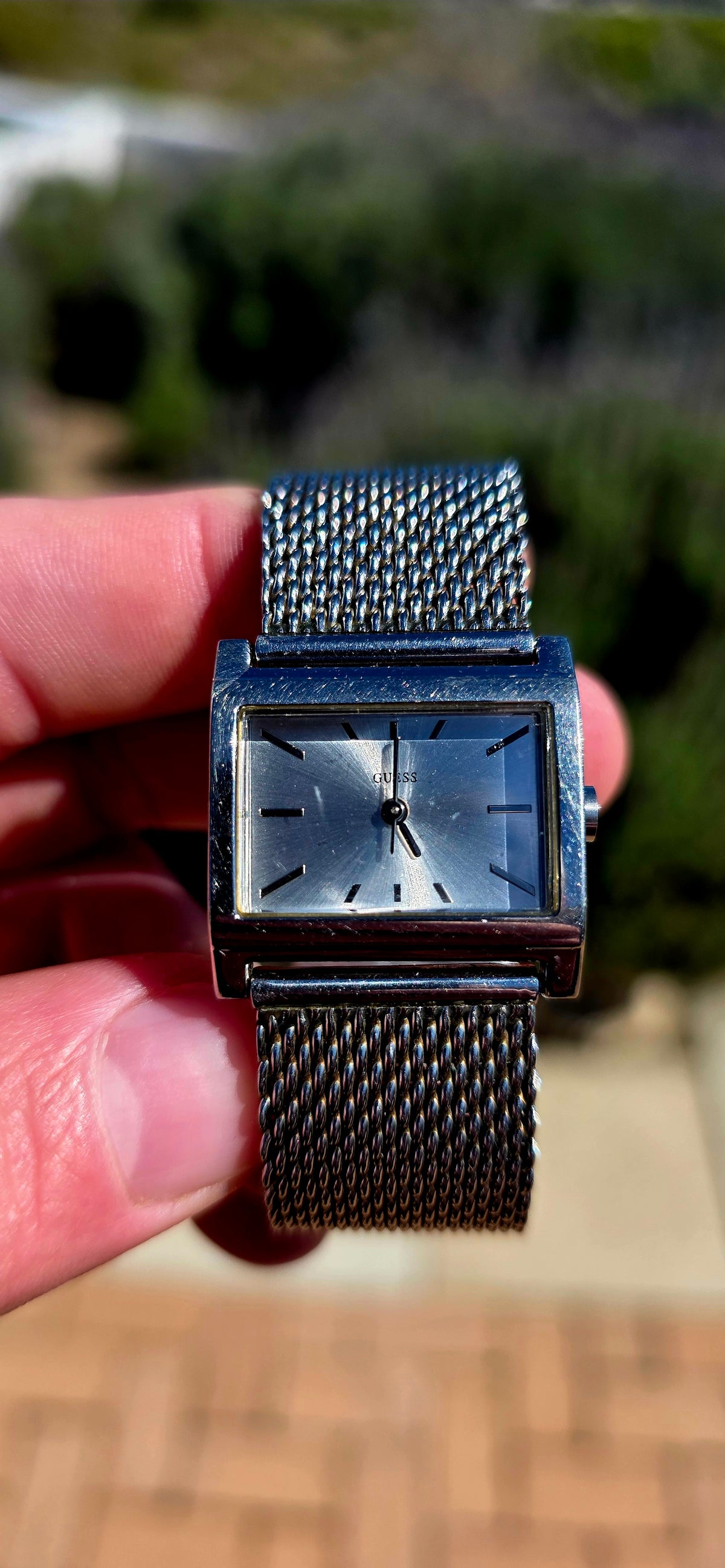 Oh this is wonderfully RETRO! A vintage ladies GUESS Mod-Mesh quartz wristwatch, combining a sleek rectangular case with a fabulous wide silver-tone woven mesh bracelet — giving it that unmistakable minimalist designer look.
