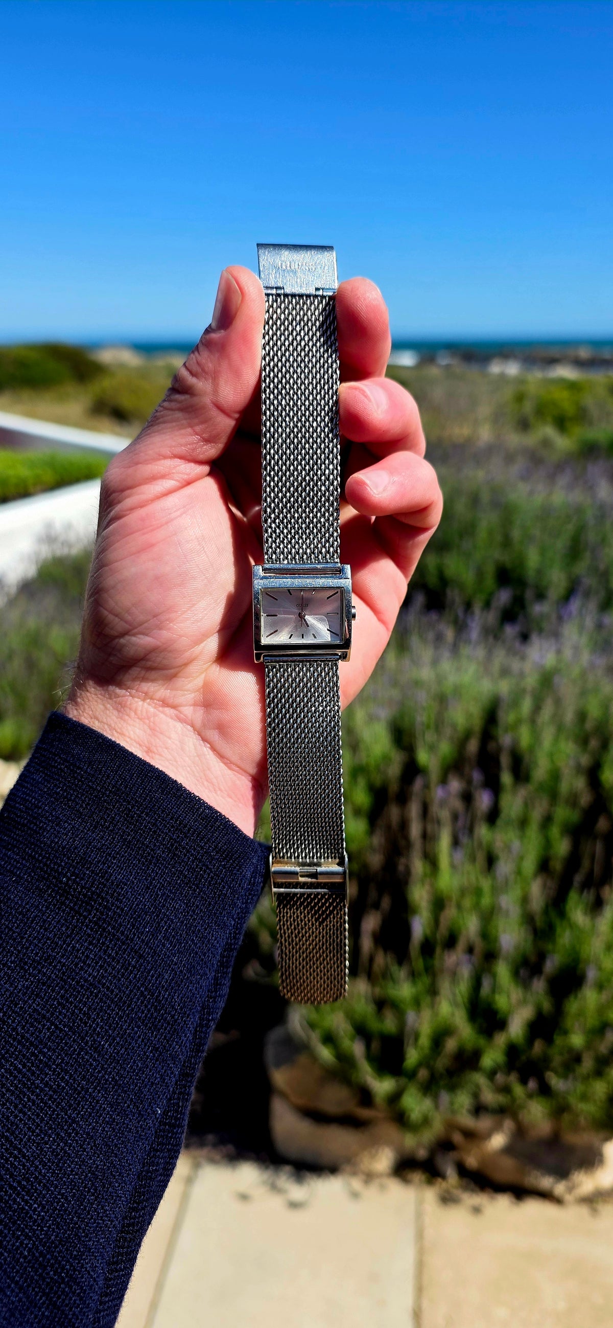 Oh this is wonderfully RETRO! A vintage ladies GUESS Mod-Mesh quartz wristwatch, combining a sleek rectangular case with a fabulous wide silver-tone woven mesh bracelet — giving it that unmistakable minimalist designer look.