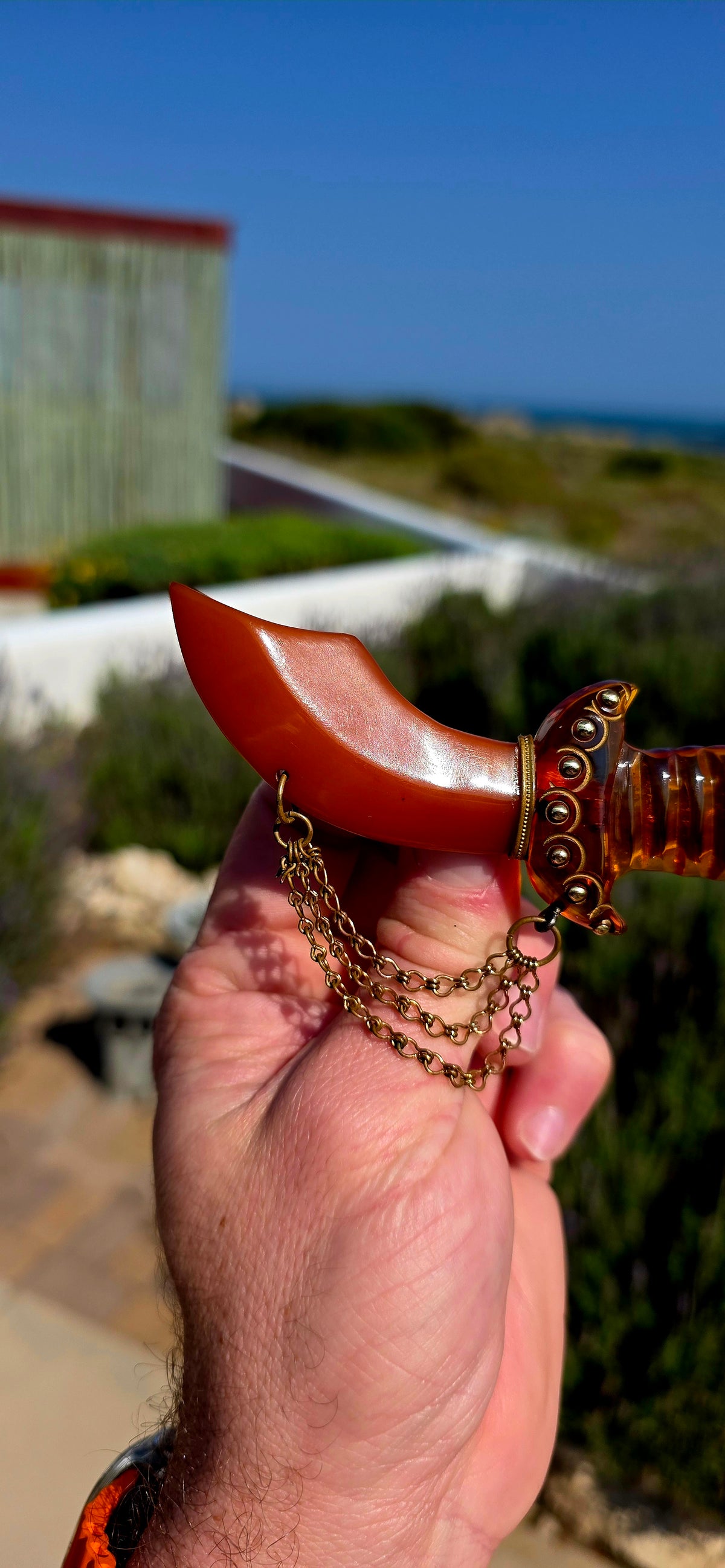 This is one for the serious Bakelite collectors! An absolutely fabulous and OVERSIZED Art Deco-era novelty brooch, dating to circa the 1930s and fashioned as an exotic Persian-style curved dagger.