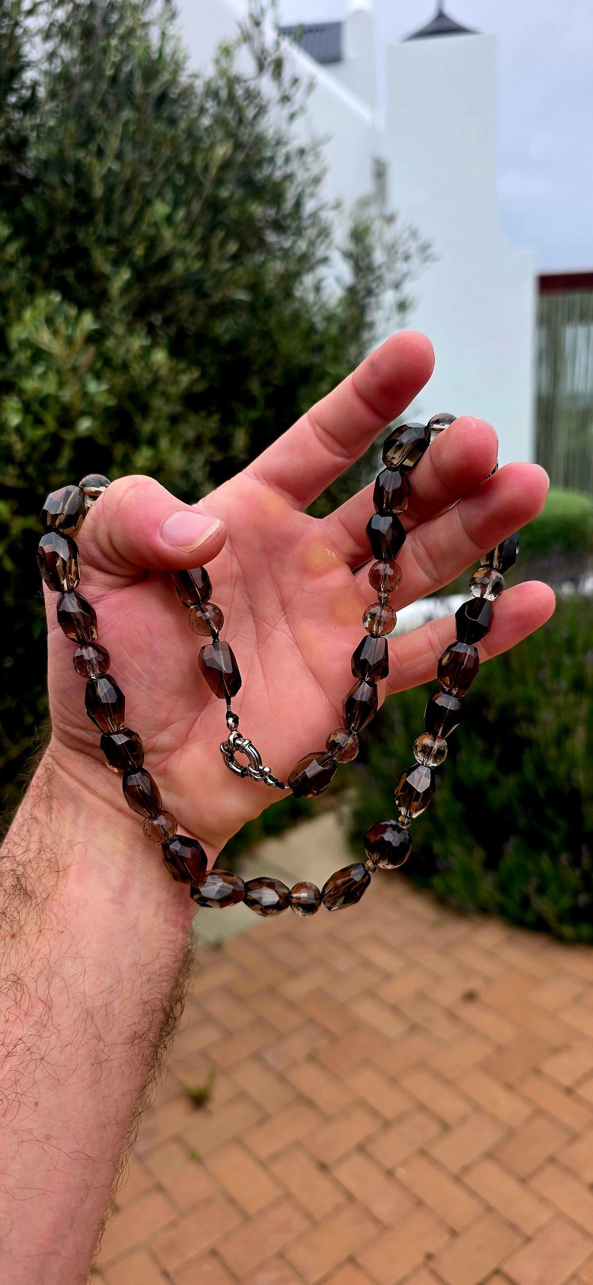 Beautifully and earthy! This necklace is composed entirely of natural smoky quartz gemstone beads, individually faceted to catch and reflect the light.