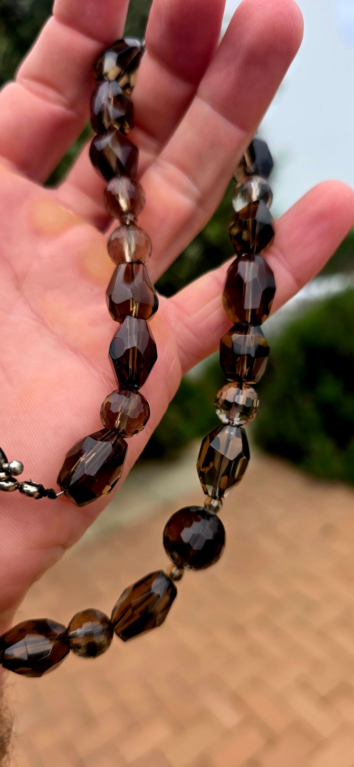 Beautifully and earthy! This necklace is composed entirely of natural smoky quartz gemstone beads, individually faceted to catch and reflect the light.