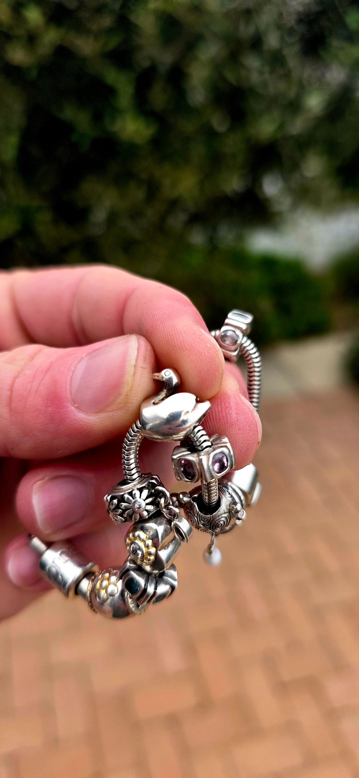 A wonderfully playful designer Donna Mia sterling silver charm bracelet, absolutely LOADED with personality!