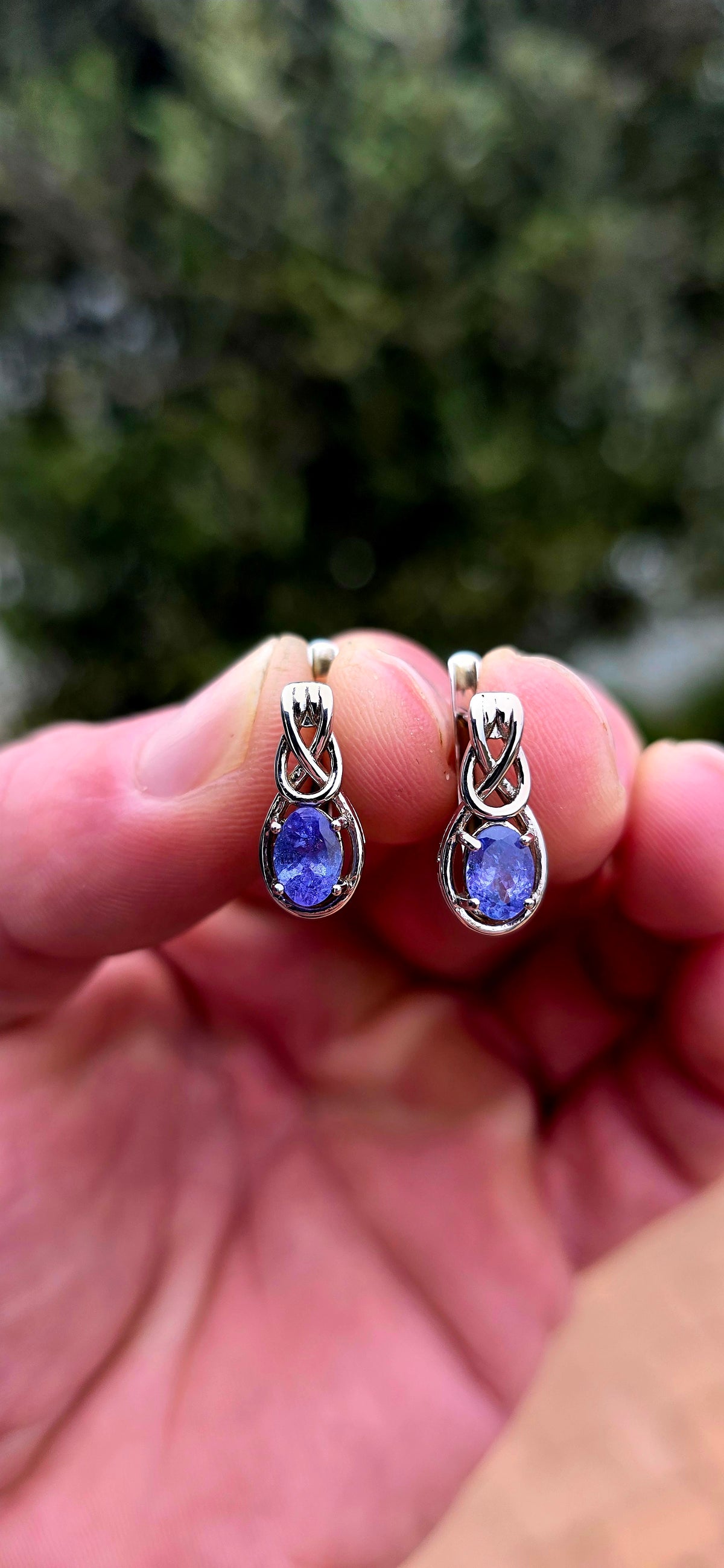Something a little SPECIAL! These beautiful sterling silver earrings combine the mesmerising violet-blue of tanzanite with the symbolism of the Celtic love knot.