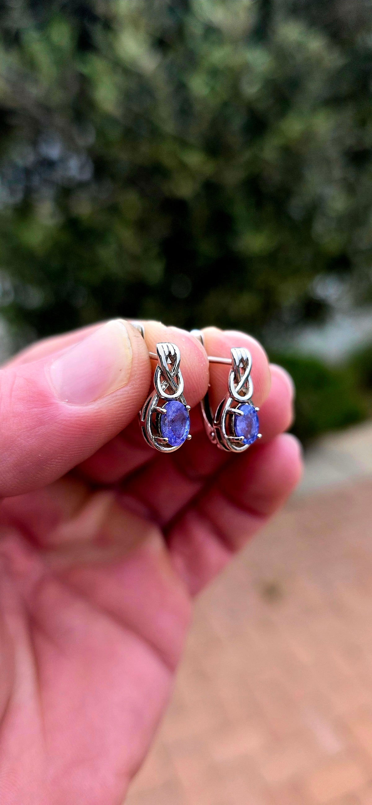 Something a little SPECIAL! These beautiful sterling silver earrings combine the mesmerising violet-blue of tanzanite with the symbolism of the Celtic love knot.