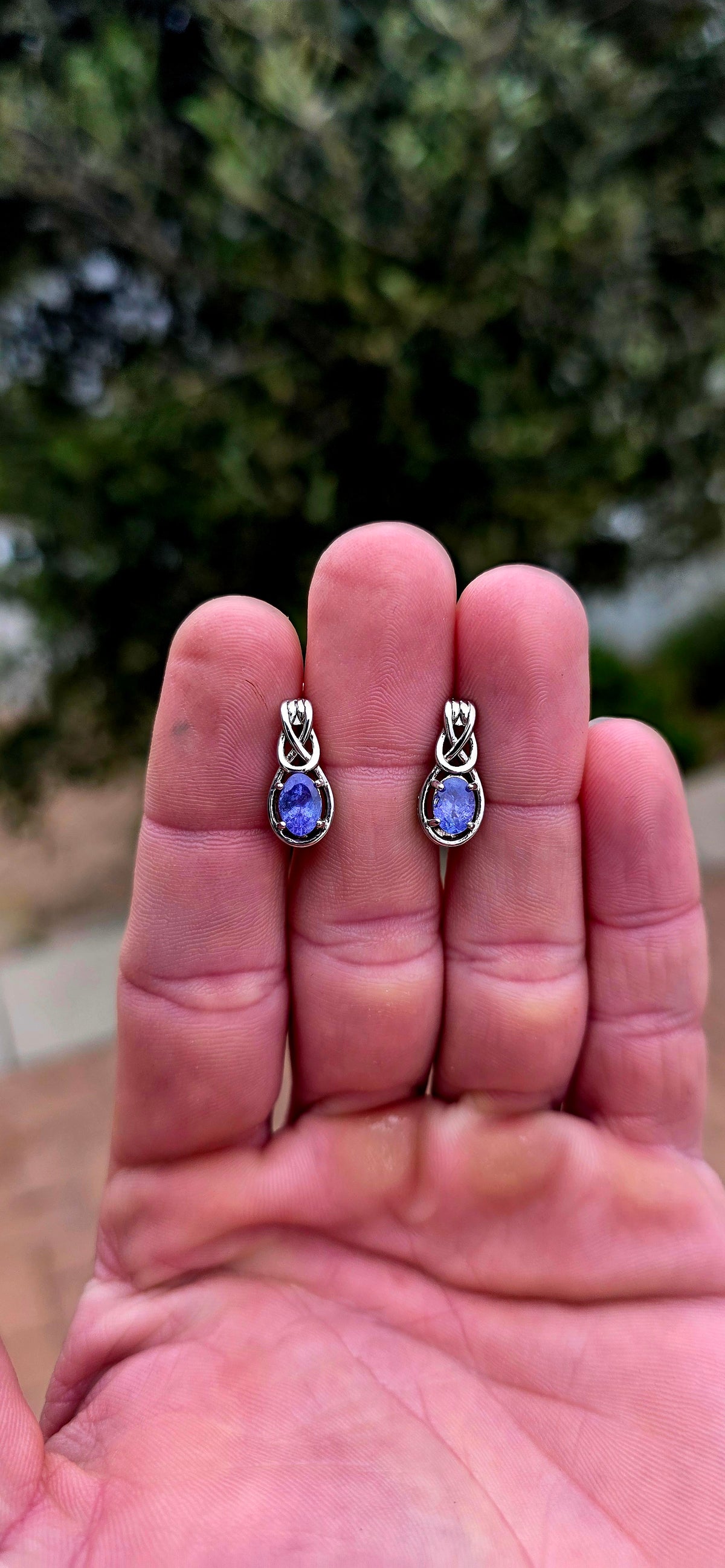 Something a little SPECIAL! These beautiful sterling silver earrings combine the mesmerising violet-blue of tanzanite with the symbolism of the Celtic love knot.