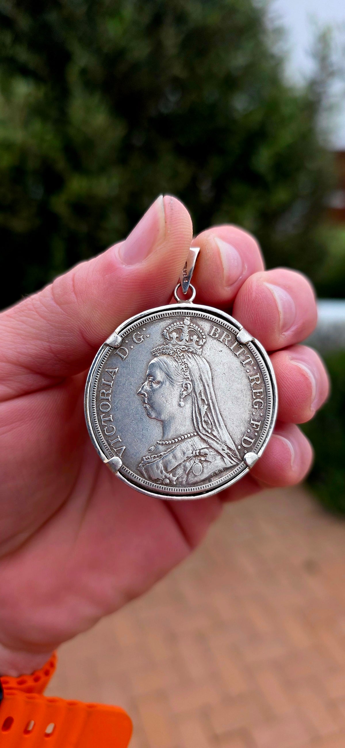 A magnificent and highly collectible Victorian Crown coin dating to 1890, struck during the reign of Queen Victoria and beautifully converted into a large statement pendant.