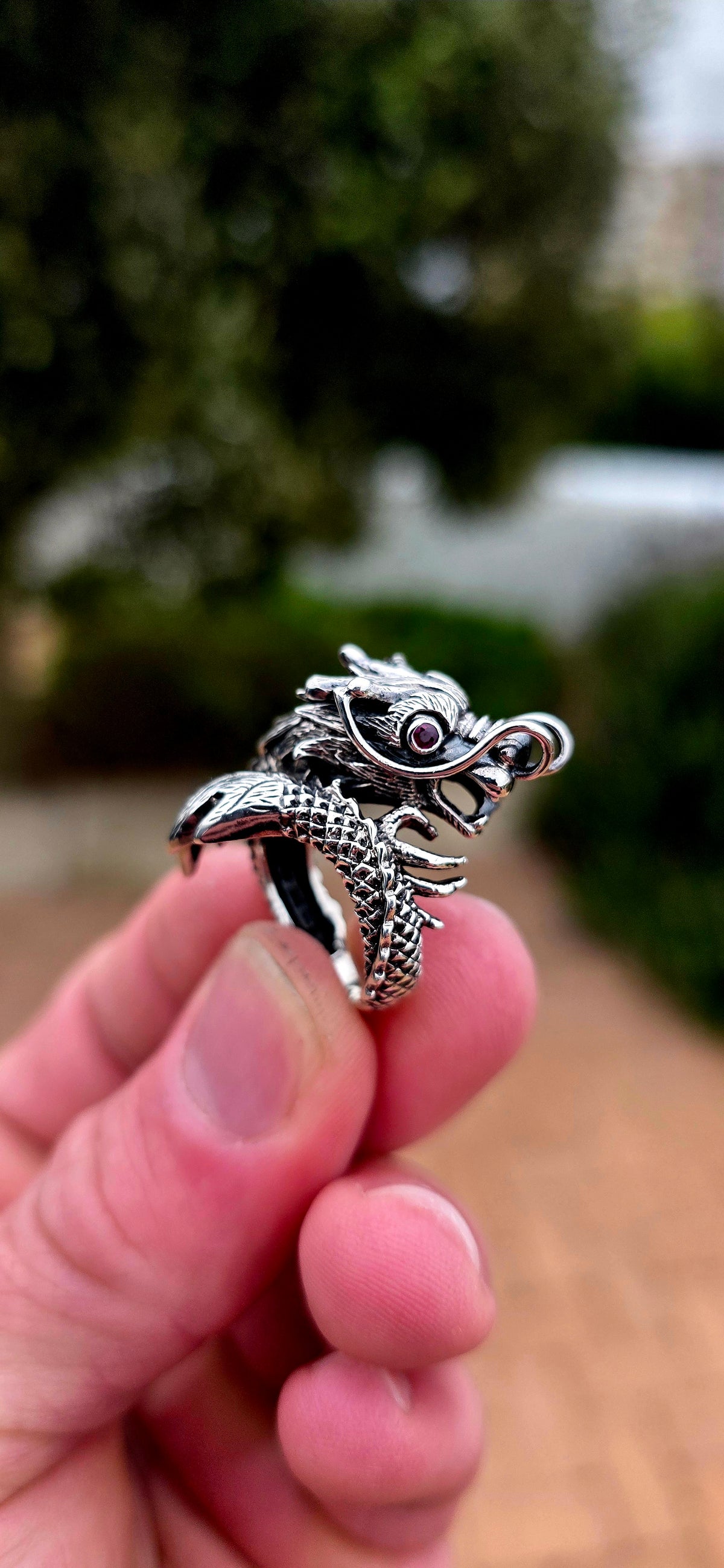 A seriously fabulous unisex chunky statement pinky ring, crafted in Sterling Silver as a magnificent three-dimensional Oriental dragon coiling dramatically around the finger.