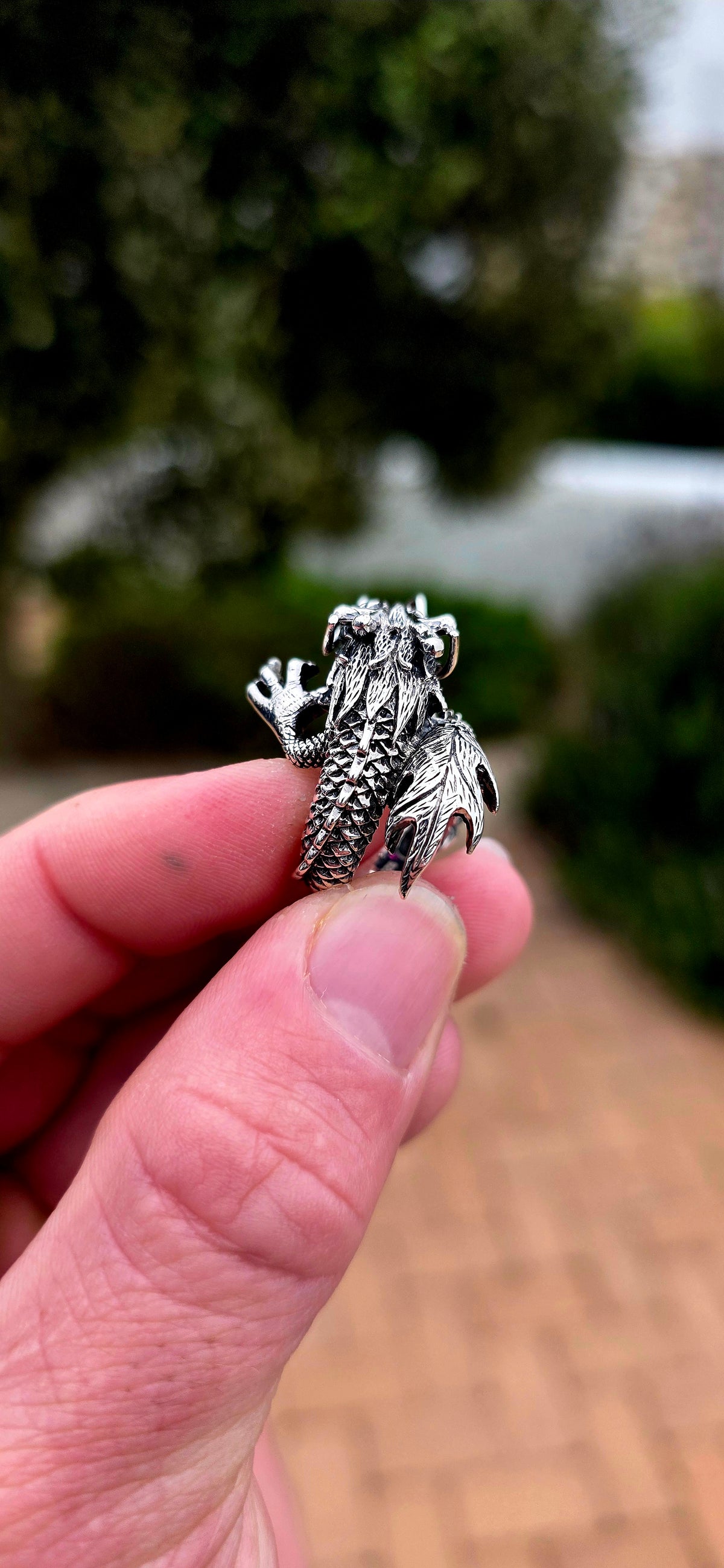 A seriously fabulous unisex chunky statement pinky ring, crafted in Sterling Silver as a magnificent three-dimensional Oriental dragon coiling dramatically around the finger.