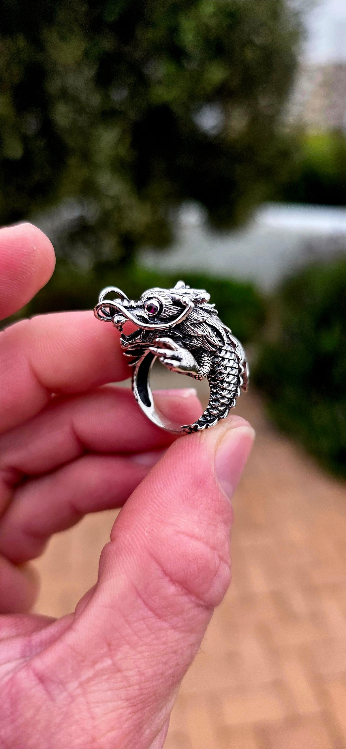 A seriously fabulous unisex chunky statement pinky ring, crafted in Sterling Silver as a magnificent three-dimensional Oriental dragon coiling dramatically around the finger.
