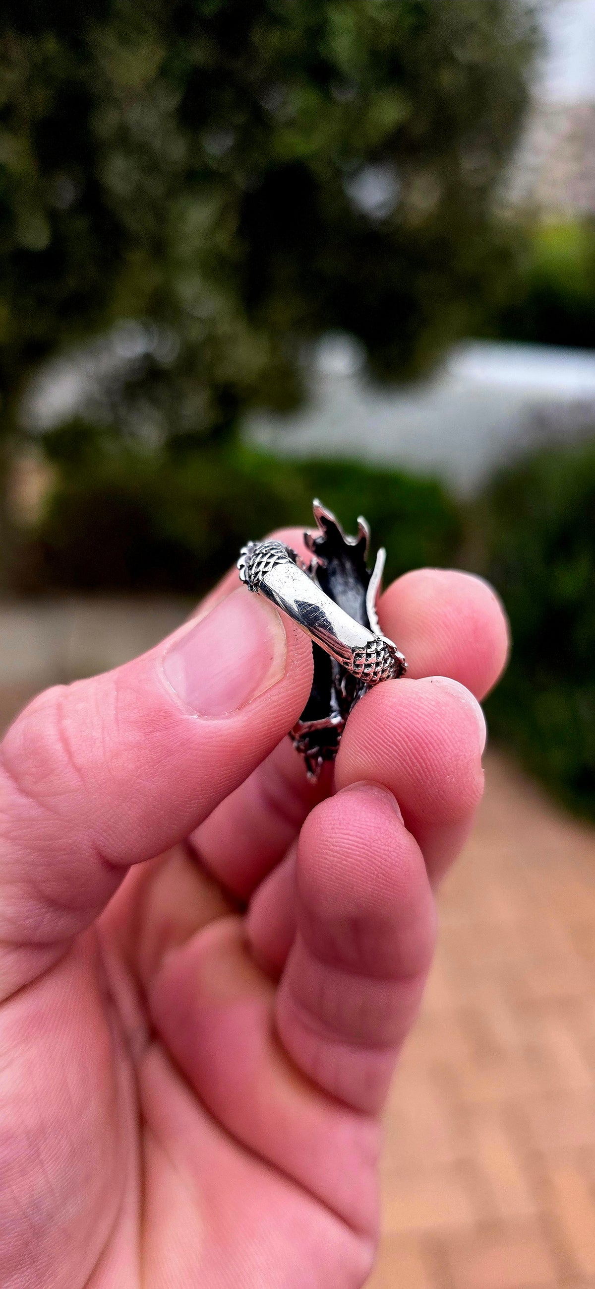 A seriously fabulous unisex chunky statement pinky ring, crafted in Sterling Silver as a magnificent three-dimensional Oriental dragon coiling dramatically around the finger.