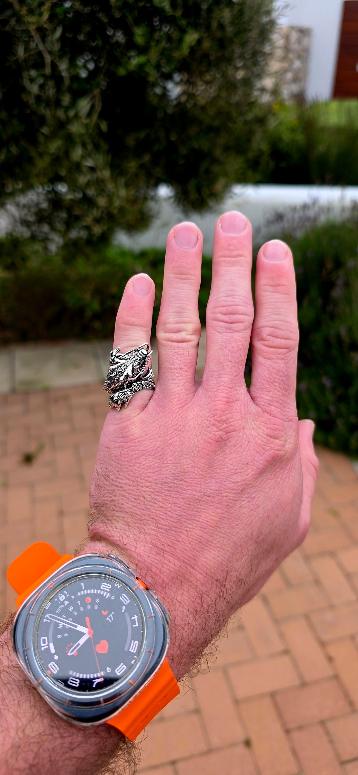 A seriously fabulous unisex chunky statement pinky ring, crafted in Sterling Silver as a magnificent three-dimensional Oriental dragon coiling dramatically around the finger.